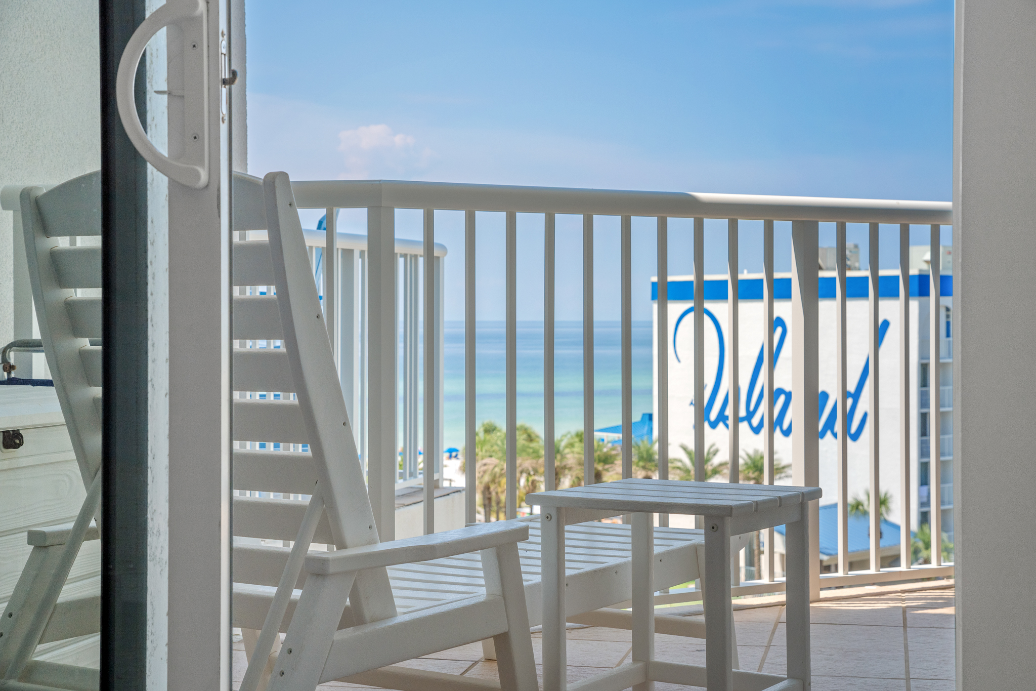 Balcony railing overlooking the area, a nice spot to step out for fresh air.