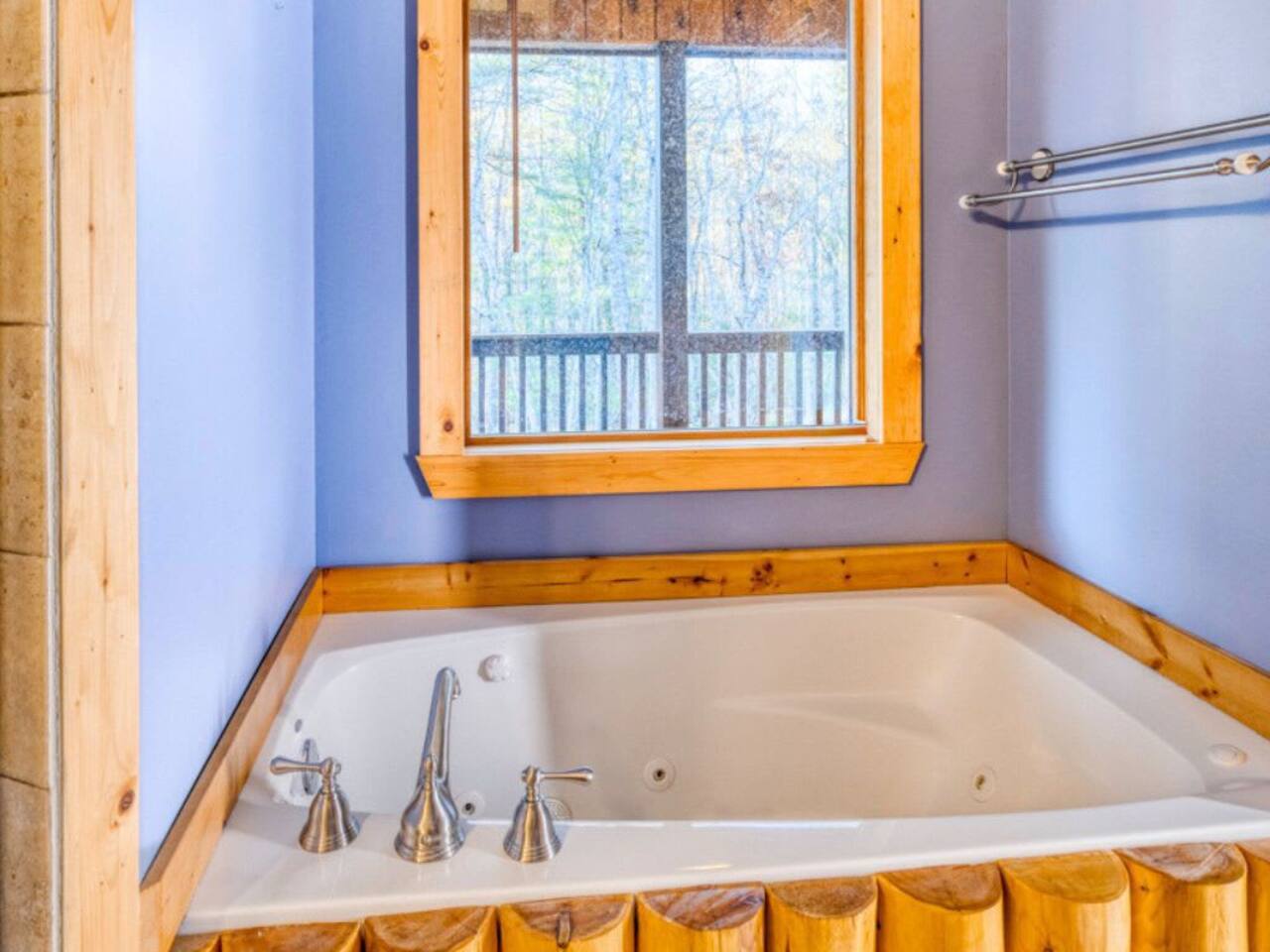 A luxurious bathtub is nestled within the master bedroom.
