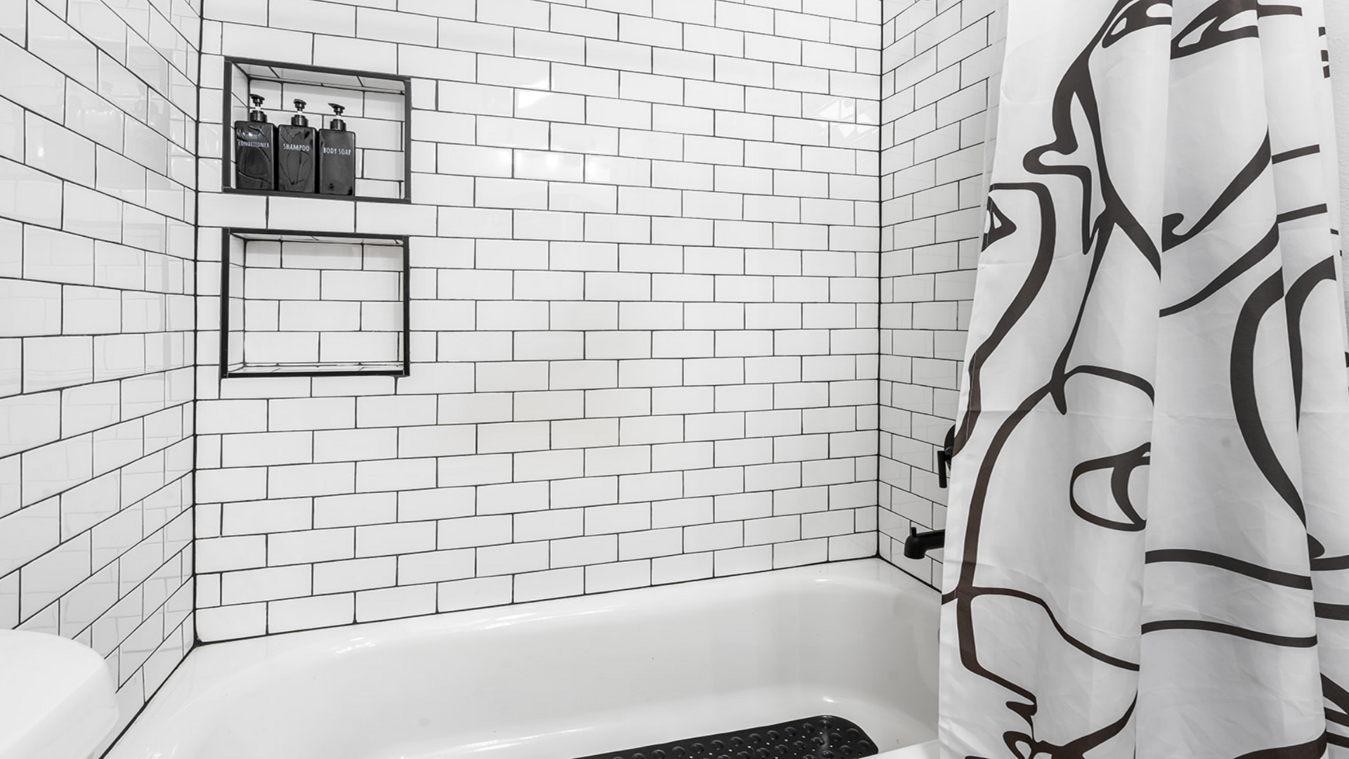 Upstairs shower stocked with the essentials and hairdryer.