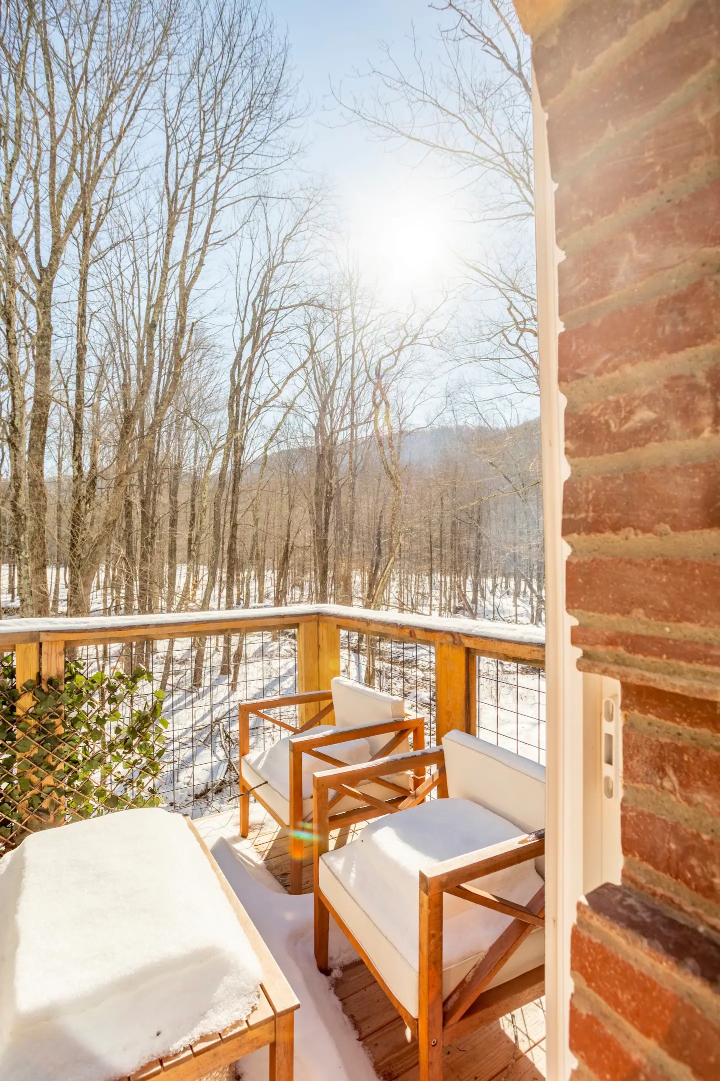 Front balcony off of primary bedroom provides private space for guests - especially when furniture isn't covered by snow!