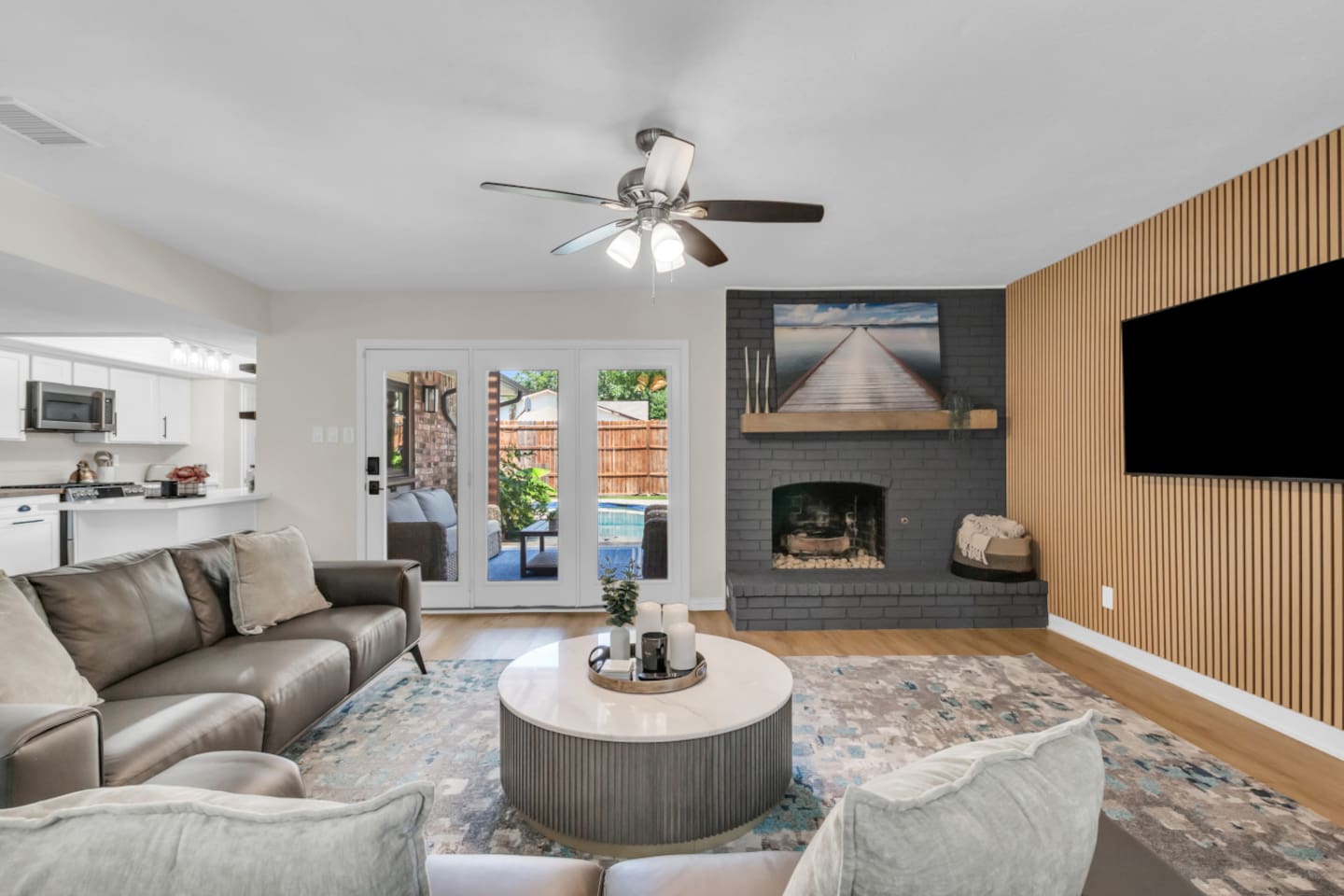 Gather around the fireplace and watch Netflix or open the double doors to connect indoors and out.