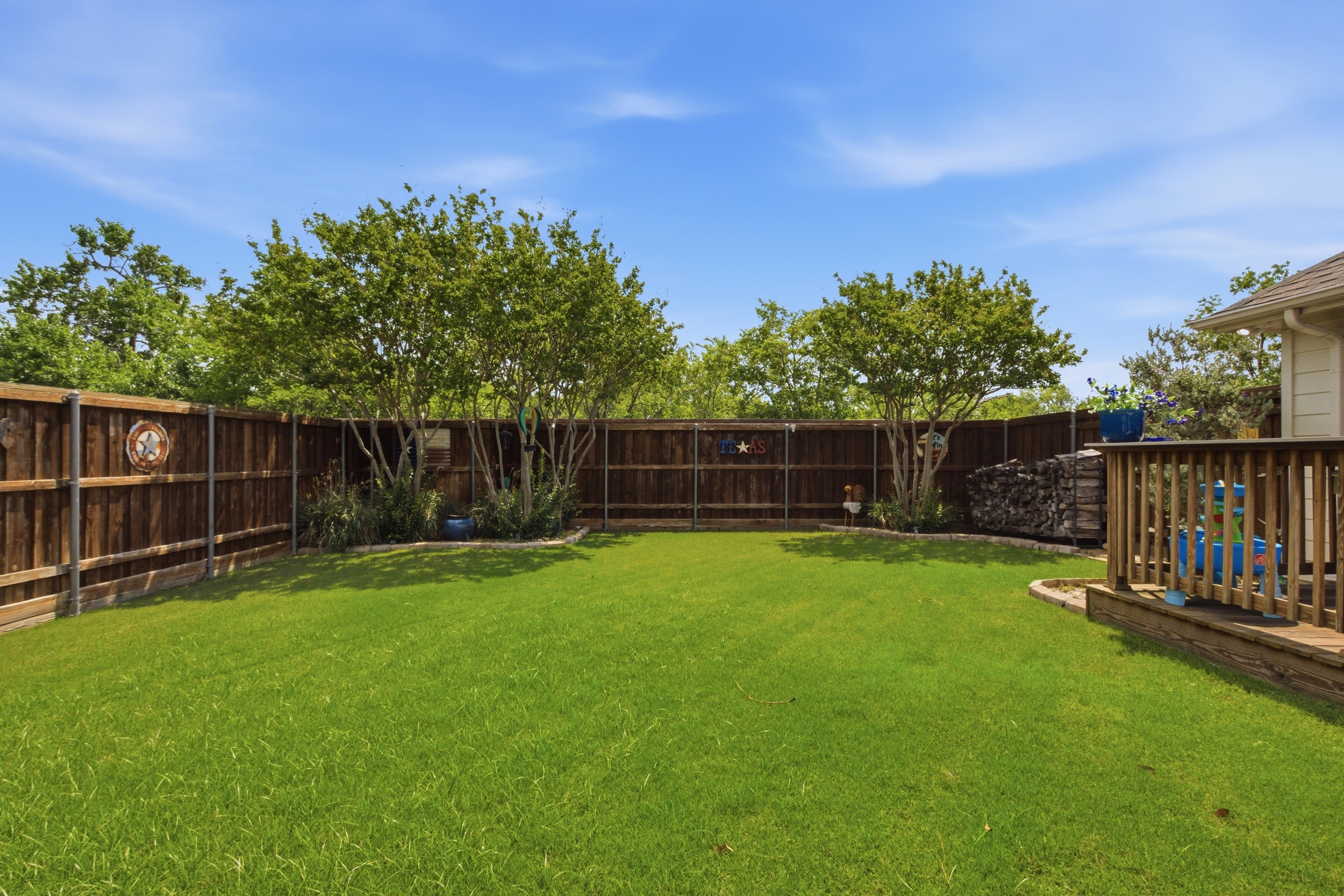 Wide-open Backyard with mature landscaping and total privacy on all sides. Whether sipping coffee at sunrise or grilling at sunset, this outdoor space delivers room to spread out and relax.