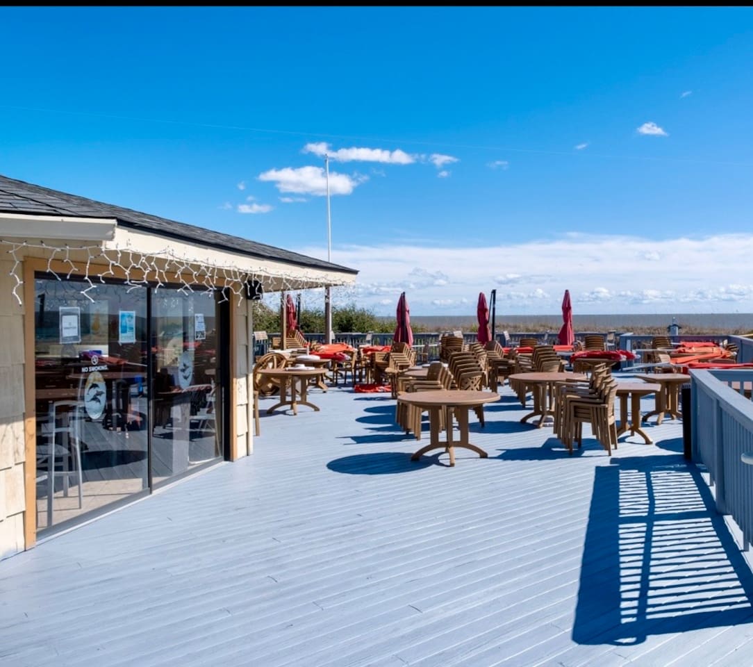 Resort deck bar with outdoor seating