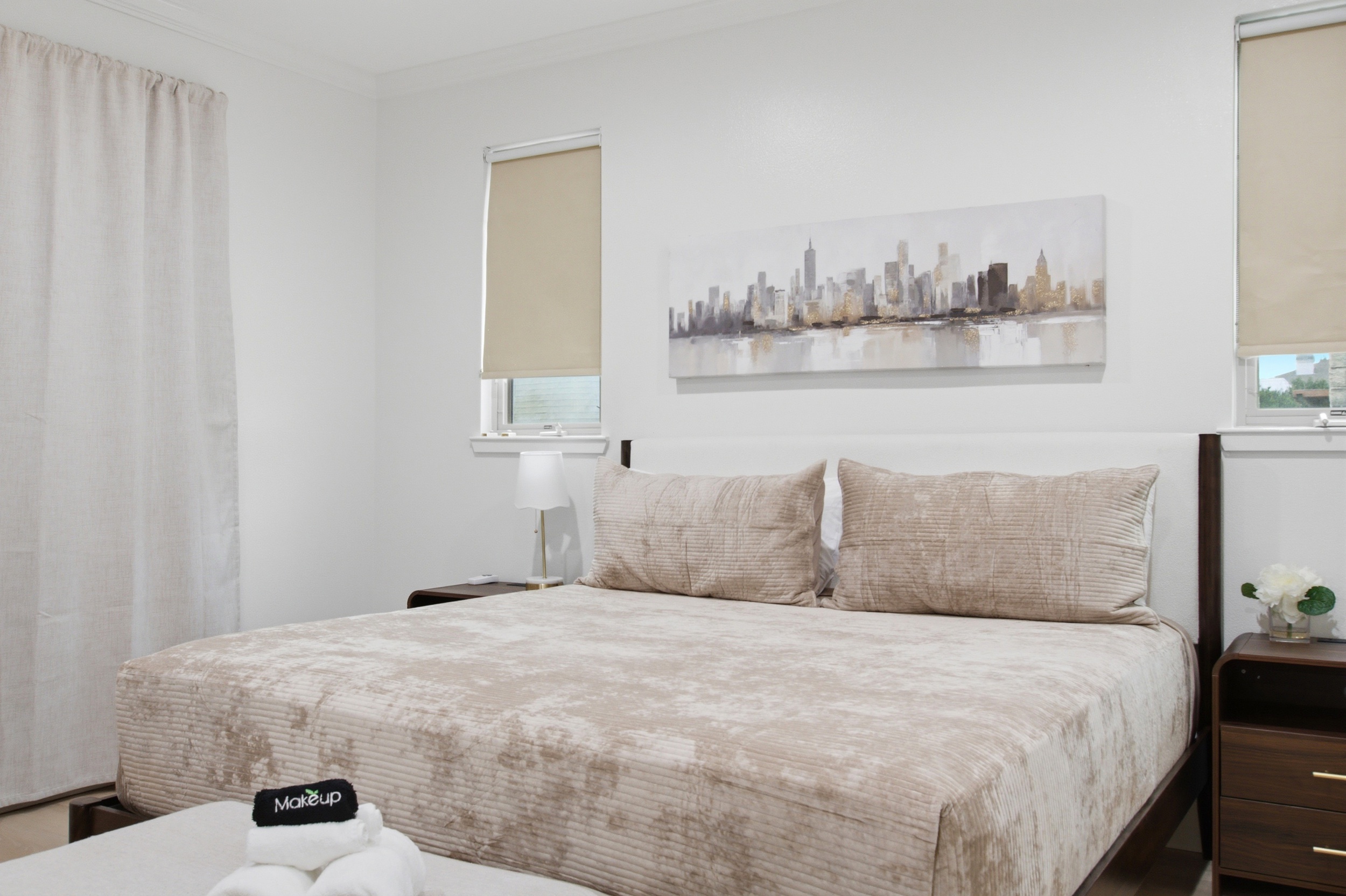 Chic bedding and city views invite relaxation after a fun day in Dallas!