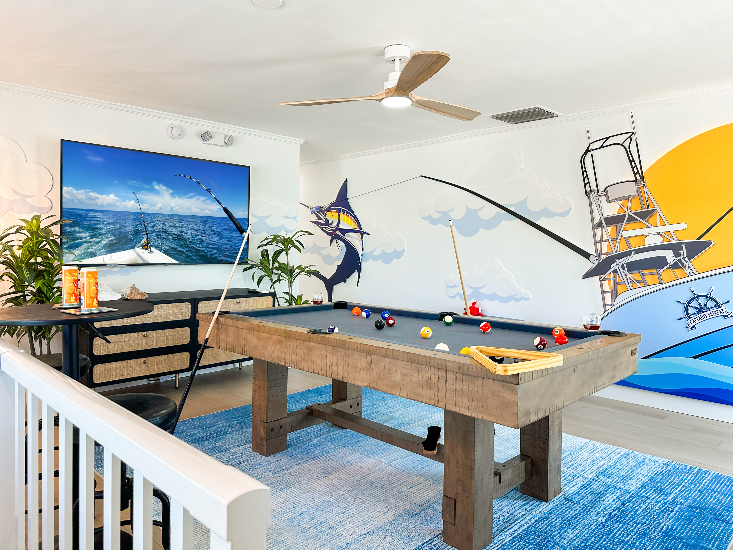 Featuring two game rooms, one including a pool table and infinity game table.