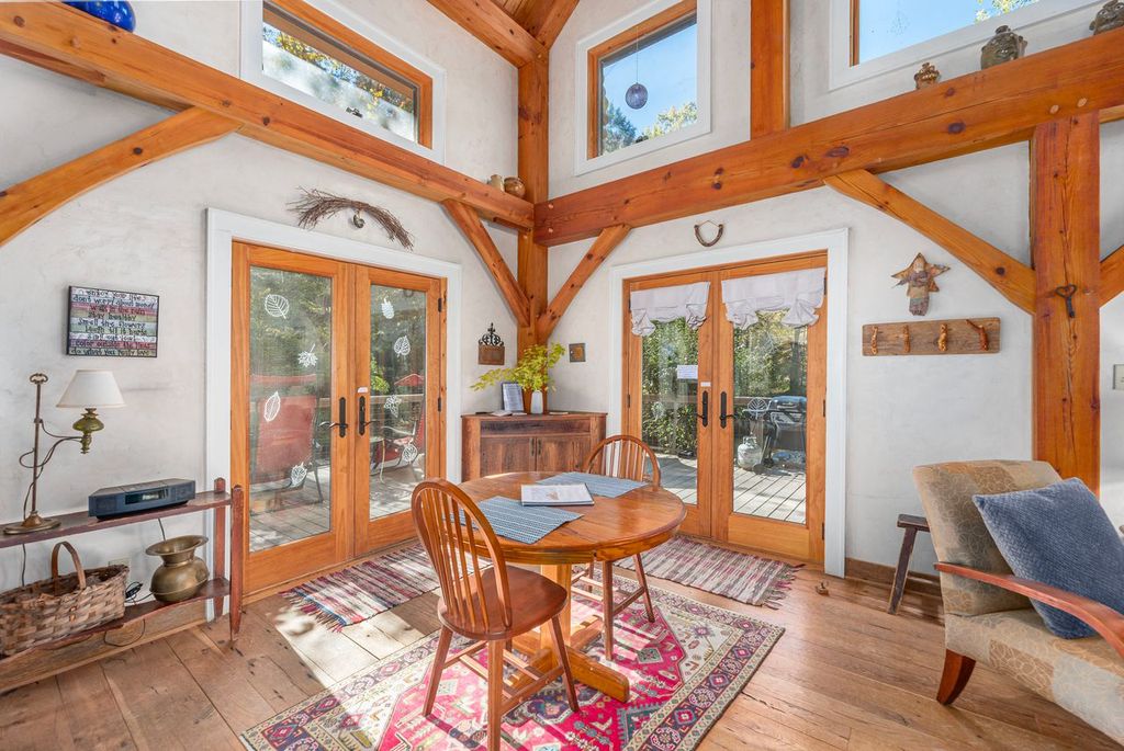 The small dining table is an exceptional spot to observe the outdoors from the warmth of the cottage.