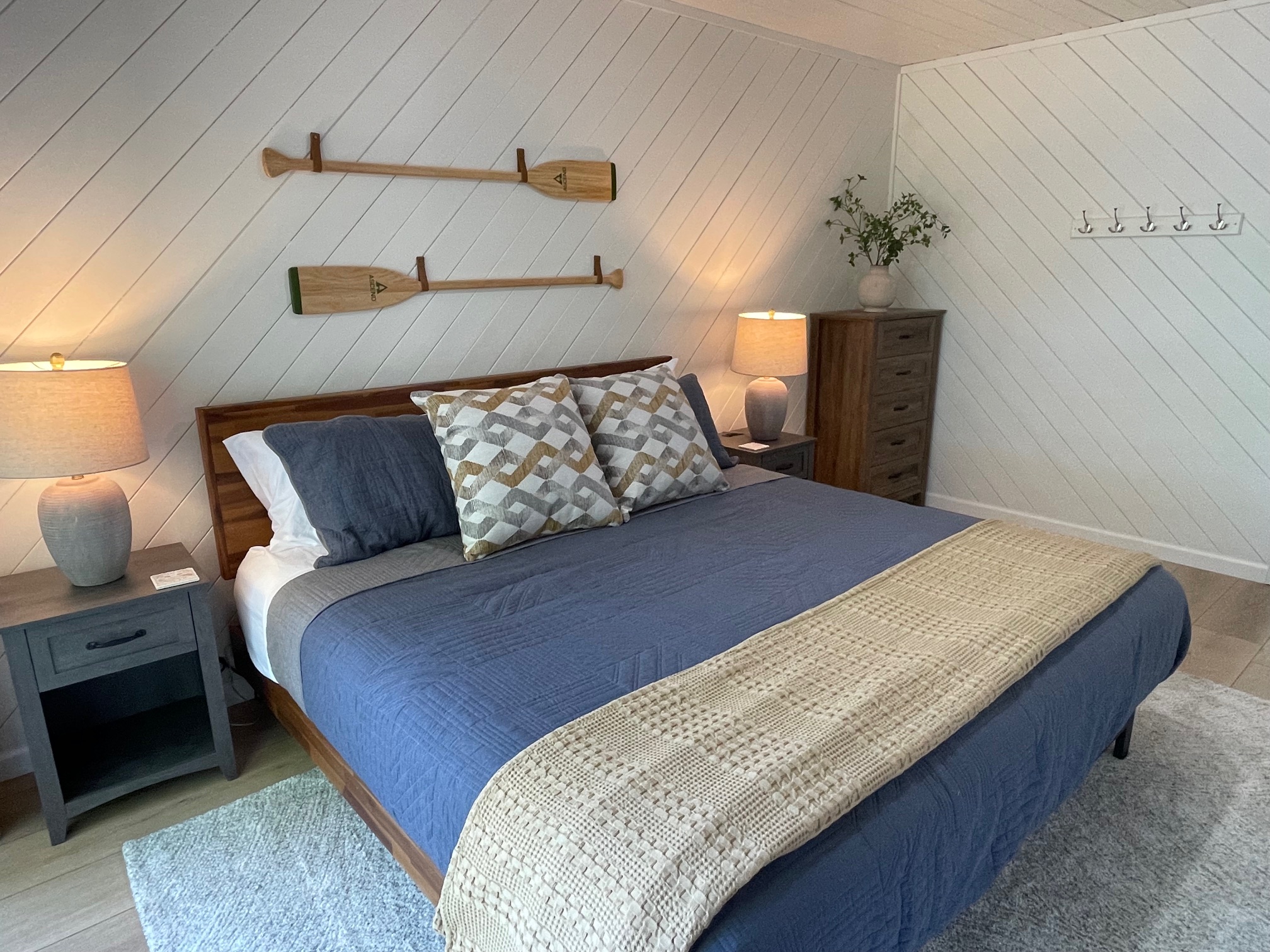 King bed, dresser and plenty of wall hooks