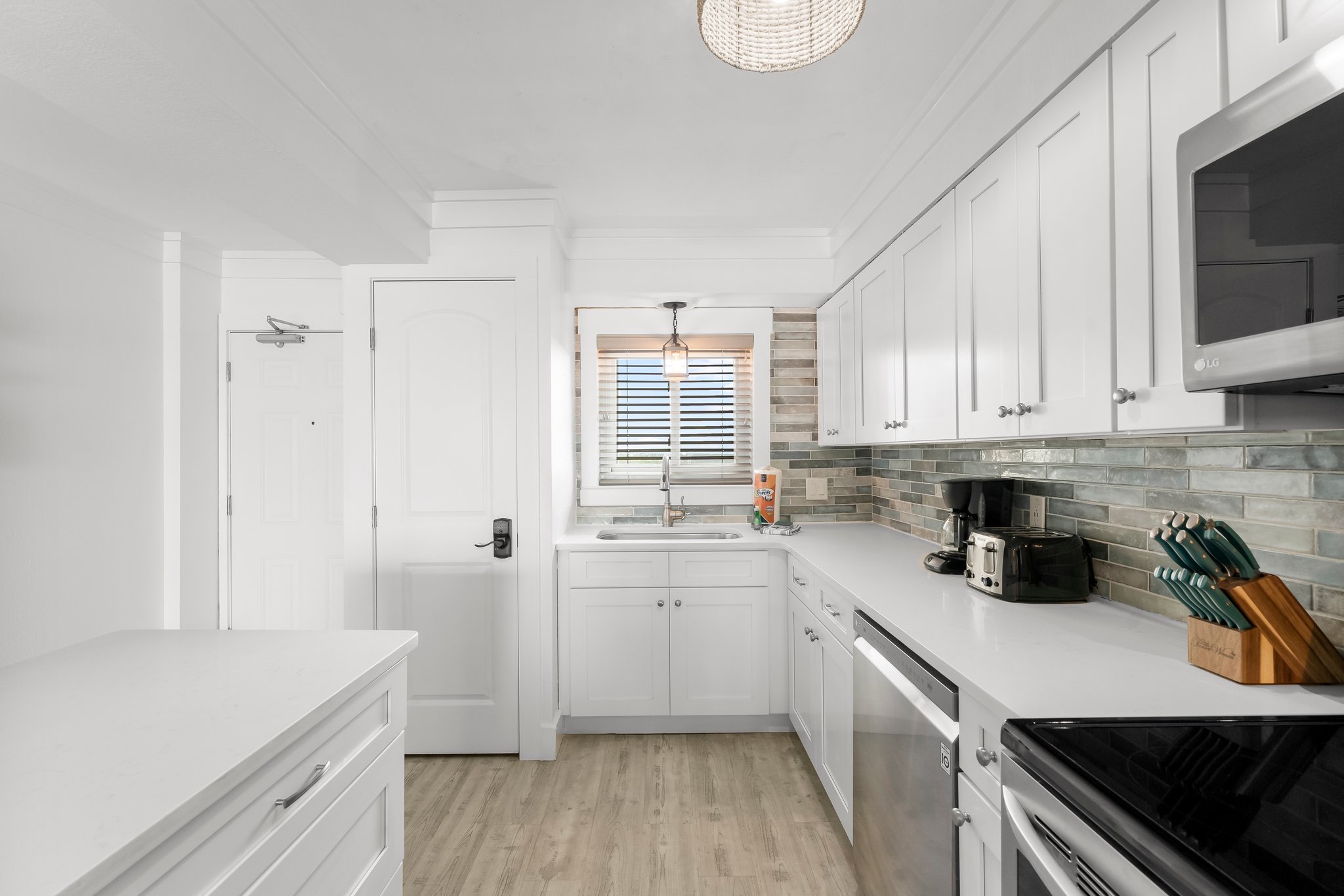 Gasp at the beautiful sunrise every morning while preparing your morning coffee in our coastal-inspired kitchen.