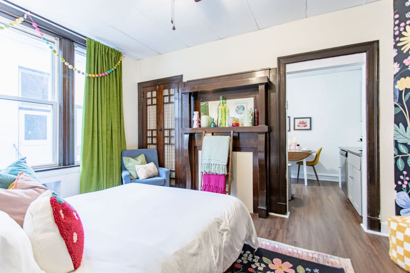 Bright and spacious living room featuring a comfortable sofa bed, perfect for relaxing or accommodating extra guests.