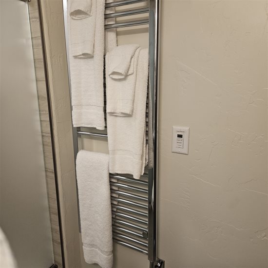 Towel warmer in bathroom.