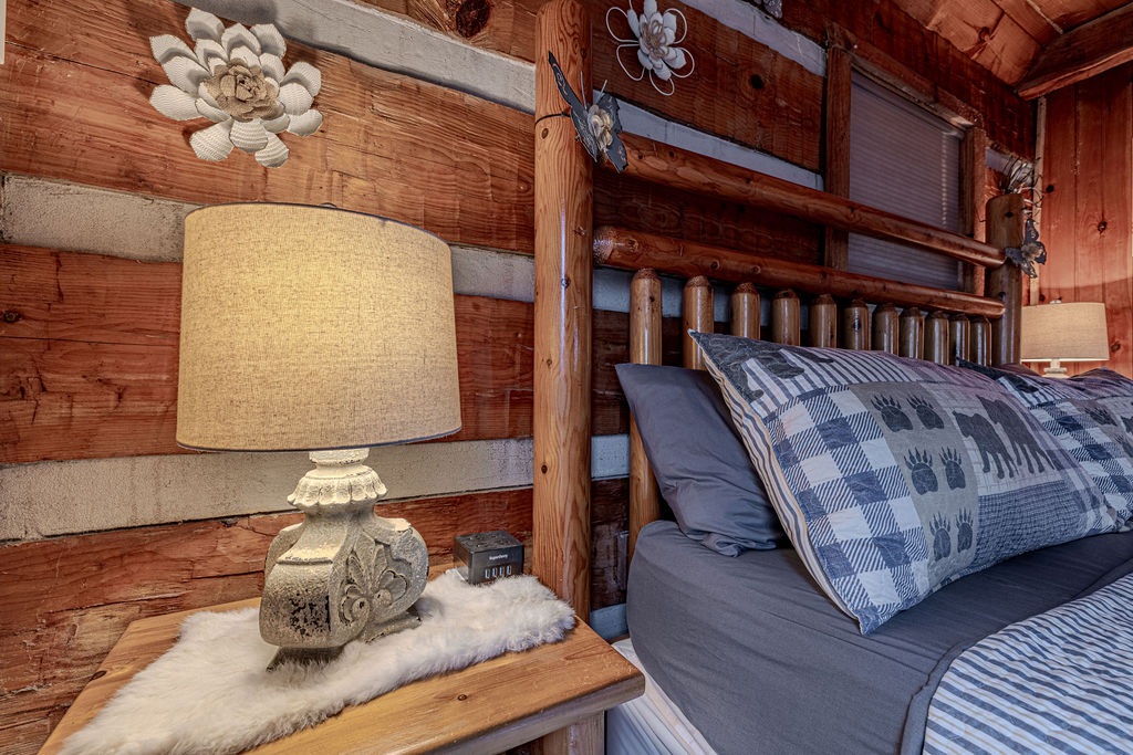 Bedside details with warm lighting and rustic wood accents