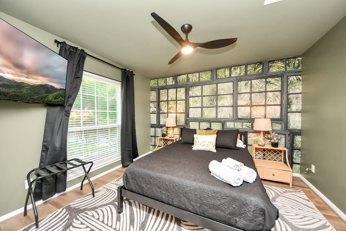 Guest Bedroom 2 showcases a captivating scene, Queen Size bed, and TV.