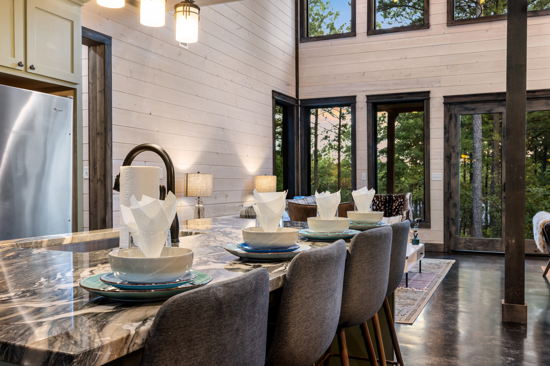 Spacious kitchen island with seating for four, perfect for casual meals, morning coffee, or gathering while cooking together.