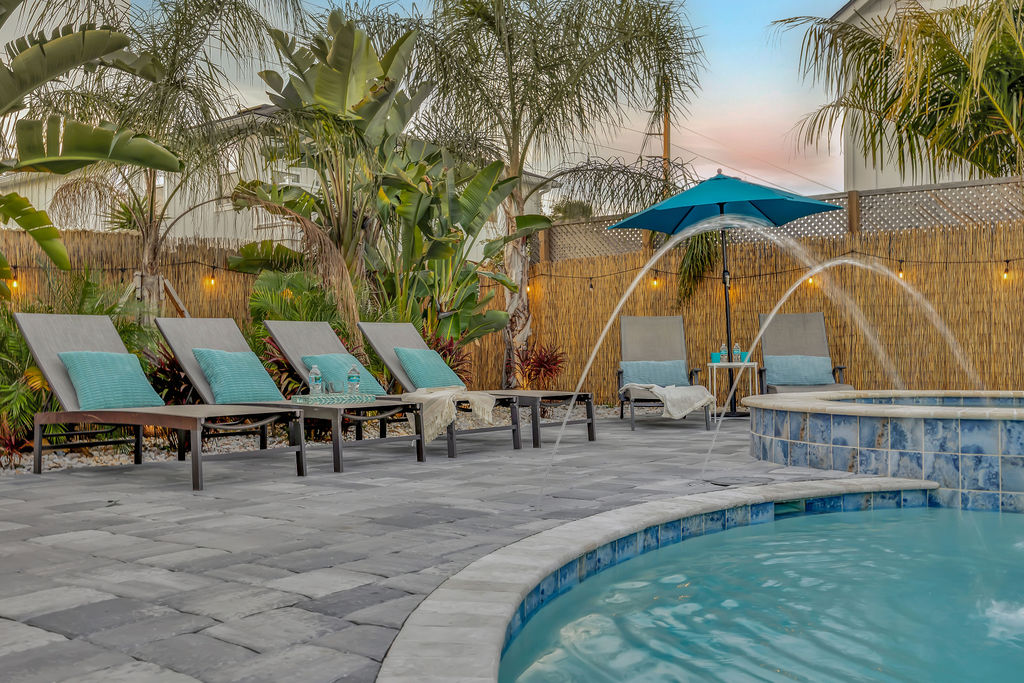 Relax in resort like loungers by the sparkling pool