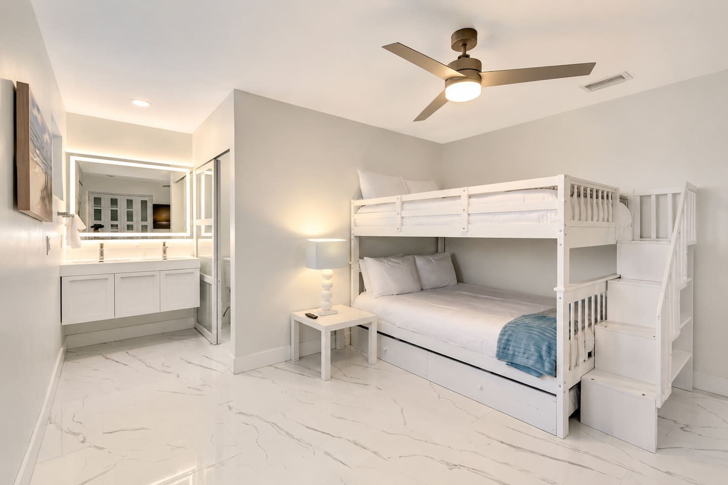 Spacious triple full-size bunk room with a private en-suite bathroom, ideal for families and groups.