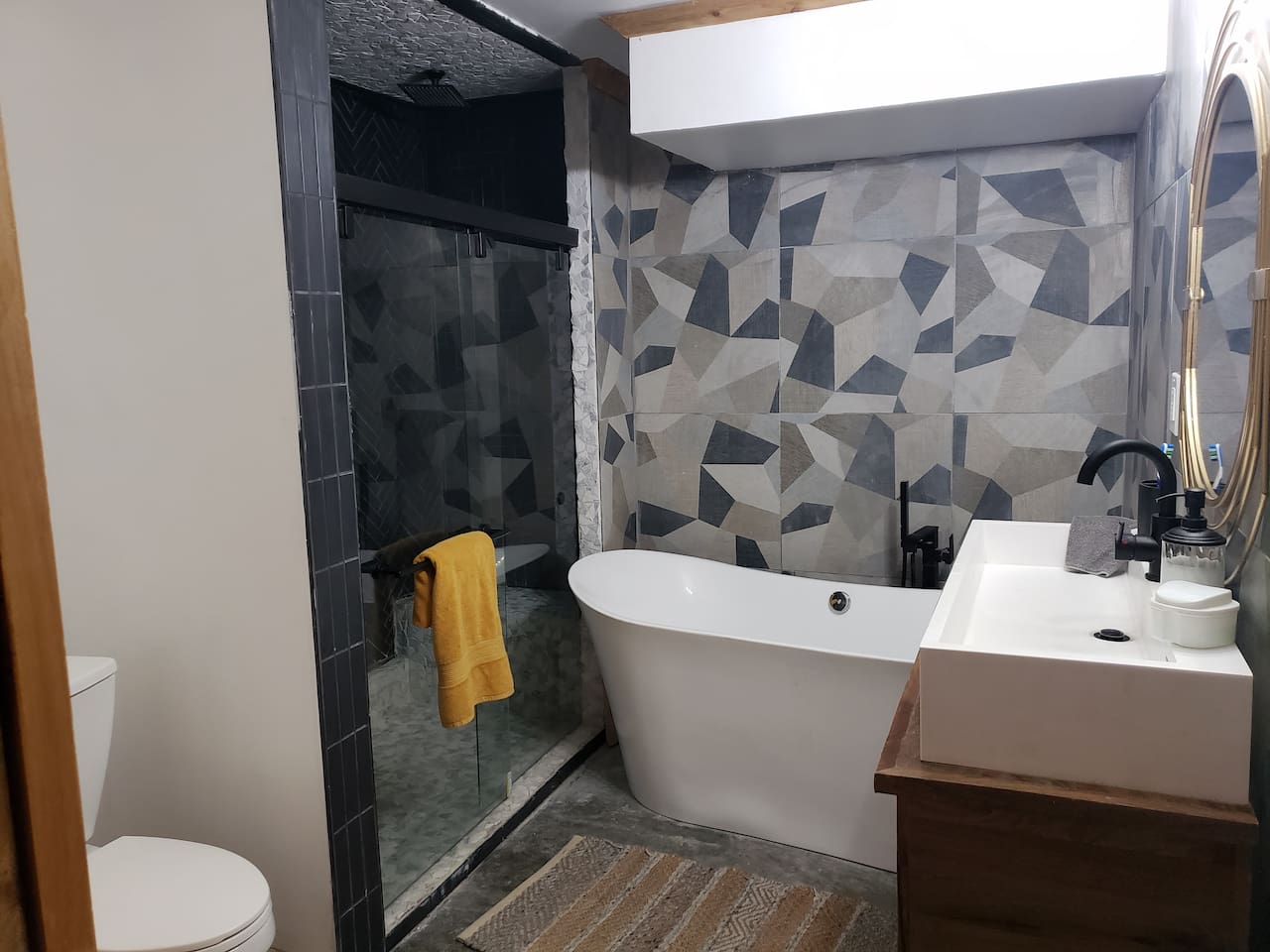 Master Bathroom in bedroom 7. Two shower  handles and heads so you both get the exact tempurature desired. Standalone tub. 