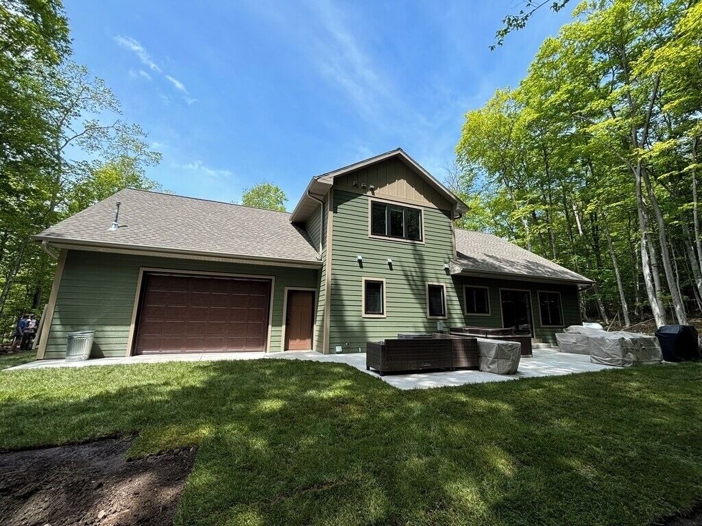 House 3 - backyard with seating area, hot tub, fire pit, and gas grill