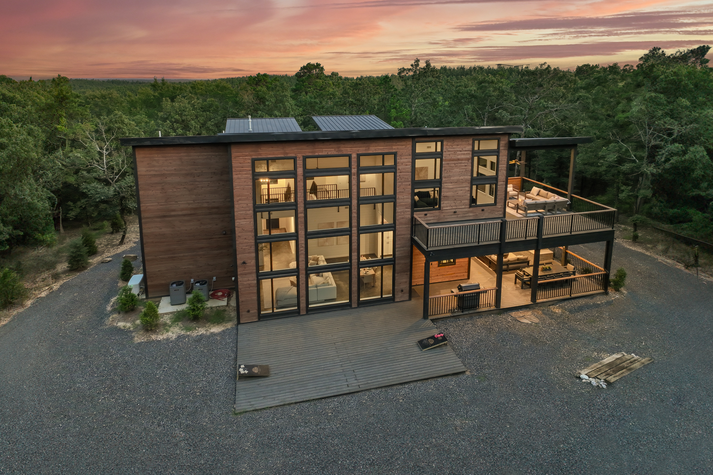 Large windows designed to draw in the beauty of the surrounding forest