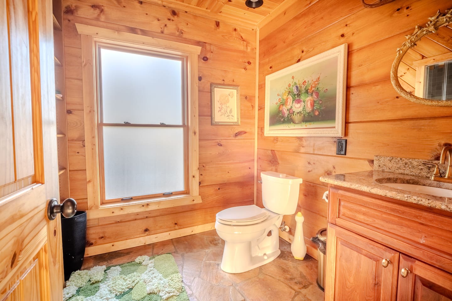 Off the living room sits a full bath (in addition to the full bath in every bedroom)