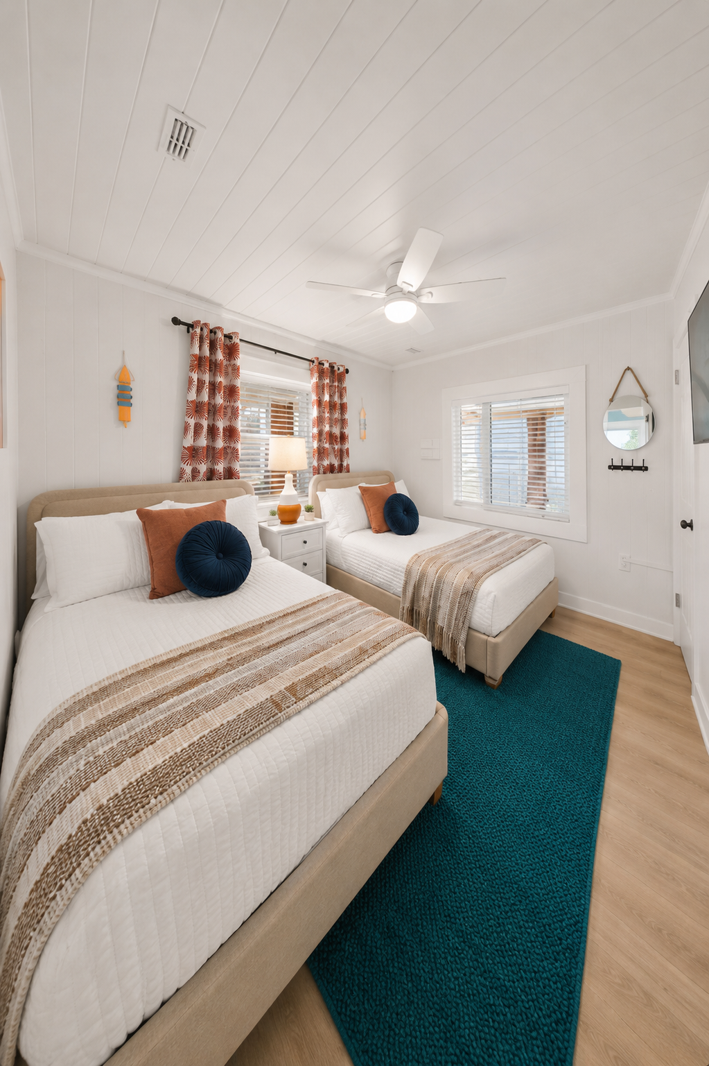 Room for two (or 4) with two full beds, a ceiling fan, and coastal
curtains complete with a flat screen TV to stream movies. Ideal for
kids sharing a room or friends traveling together who need their own space.