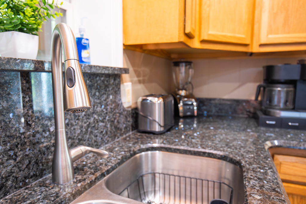 Modern sink with pull-down sprayer makes cooking and clean-up a breeze.