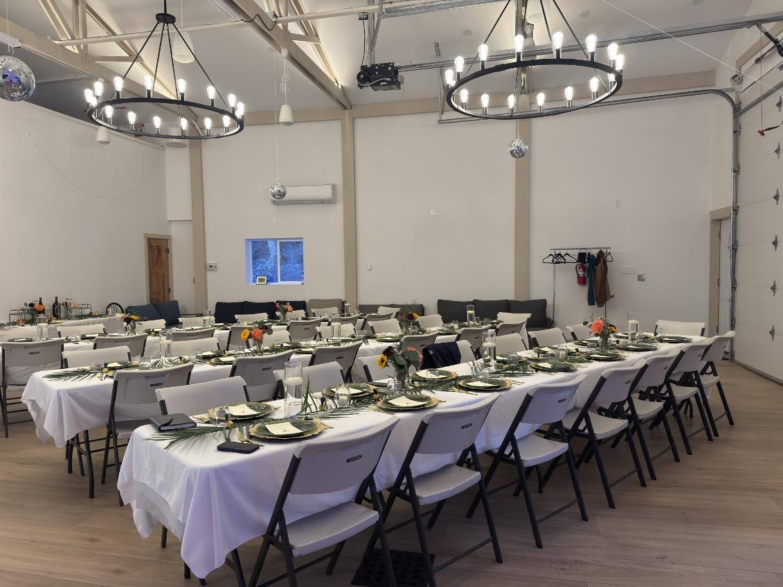 Tables, chairs, multiple pieces of place setting provided