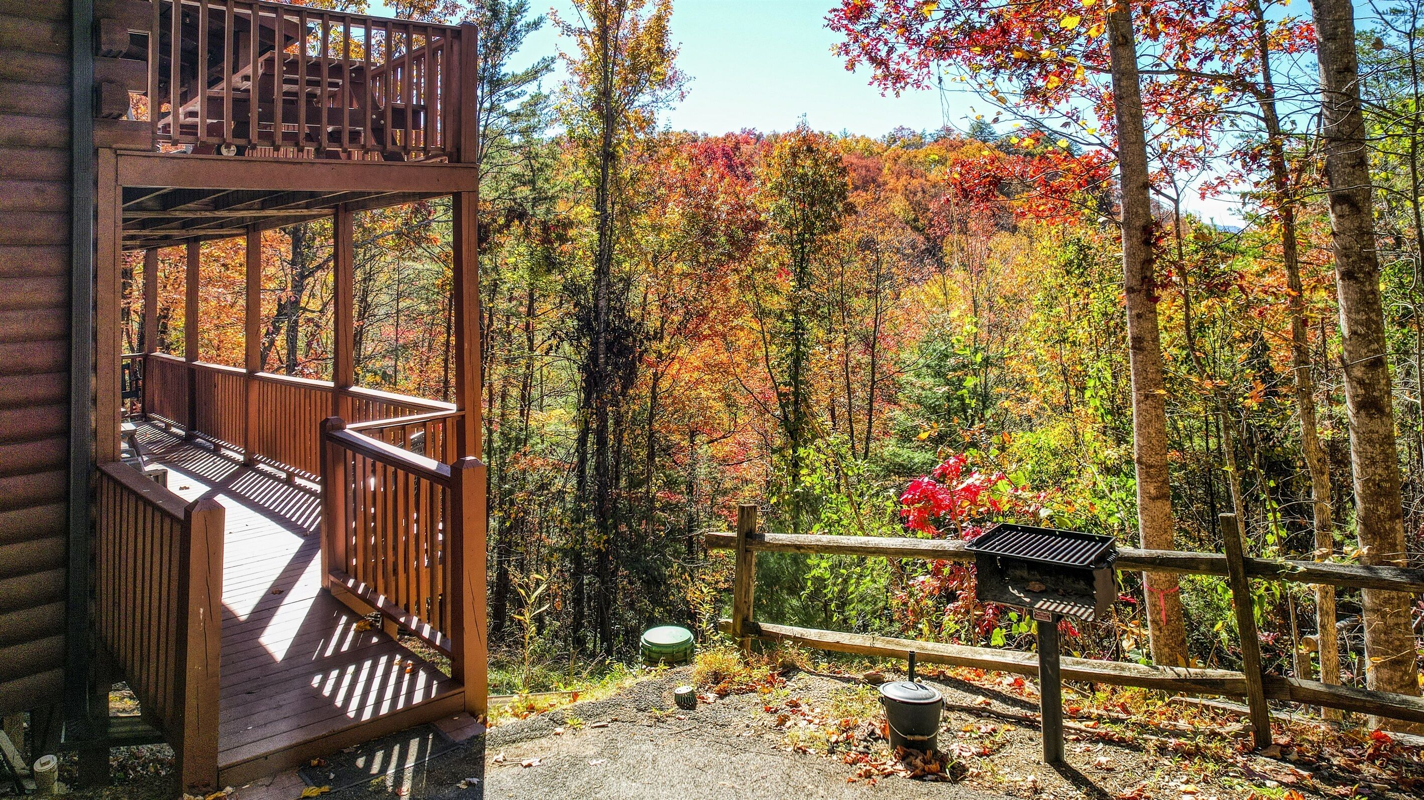 Charcoal grill for you to use overlooking the beautiful trees.