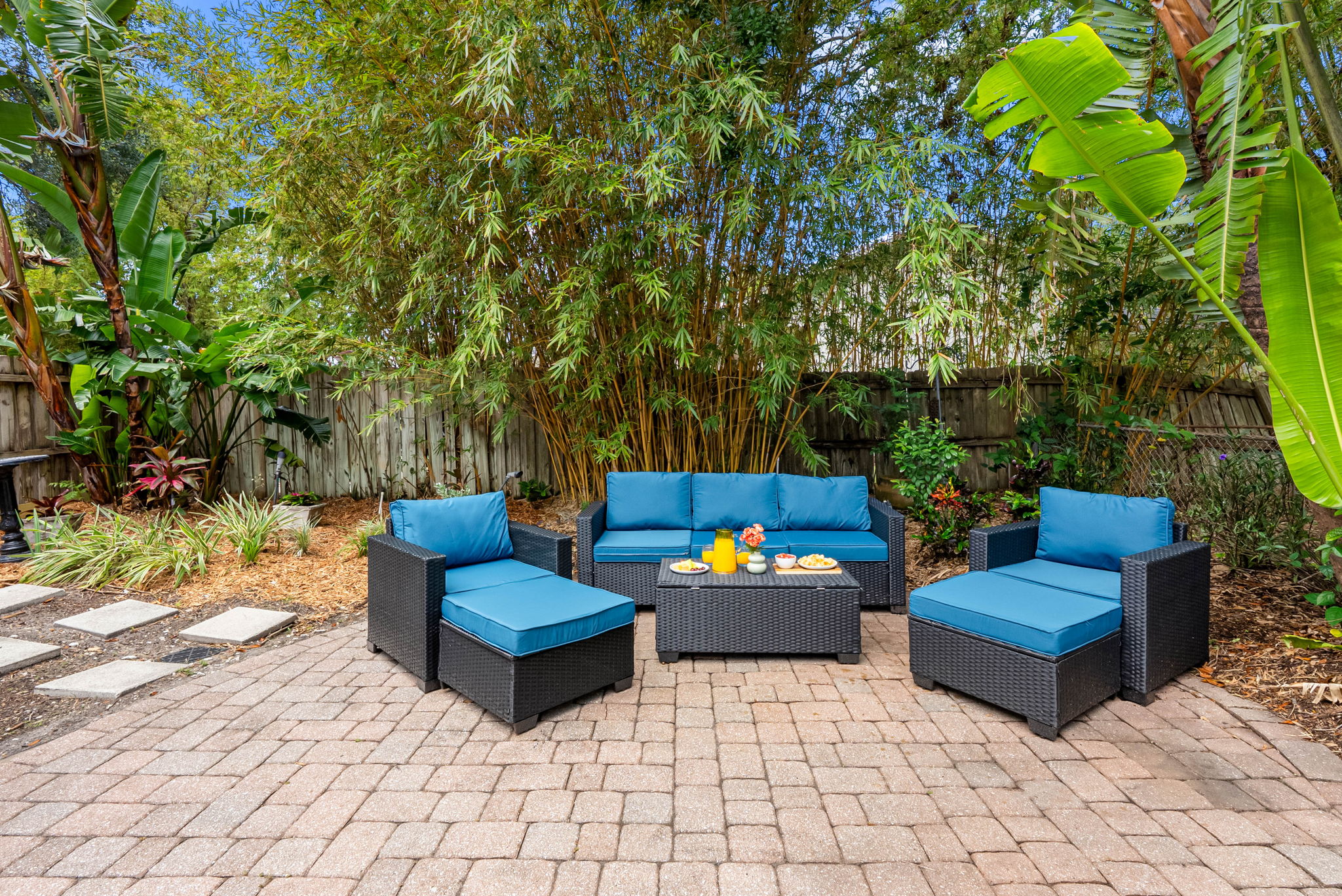 Perfect for savoring sunny mornings, hosting evening cookouts, or simply relaxing in the shade of lush tropical greenery.