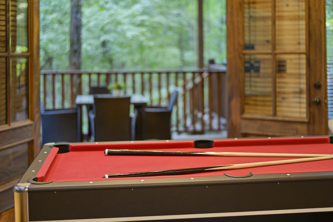 Double french doors off the game room allow you to take in the beauty of the outdoors.