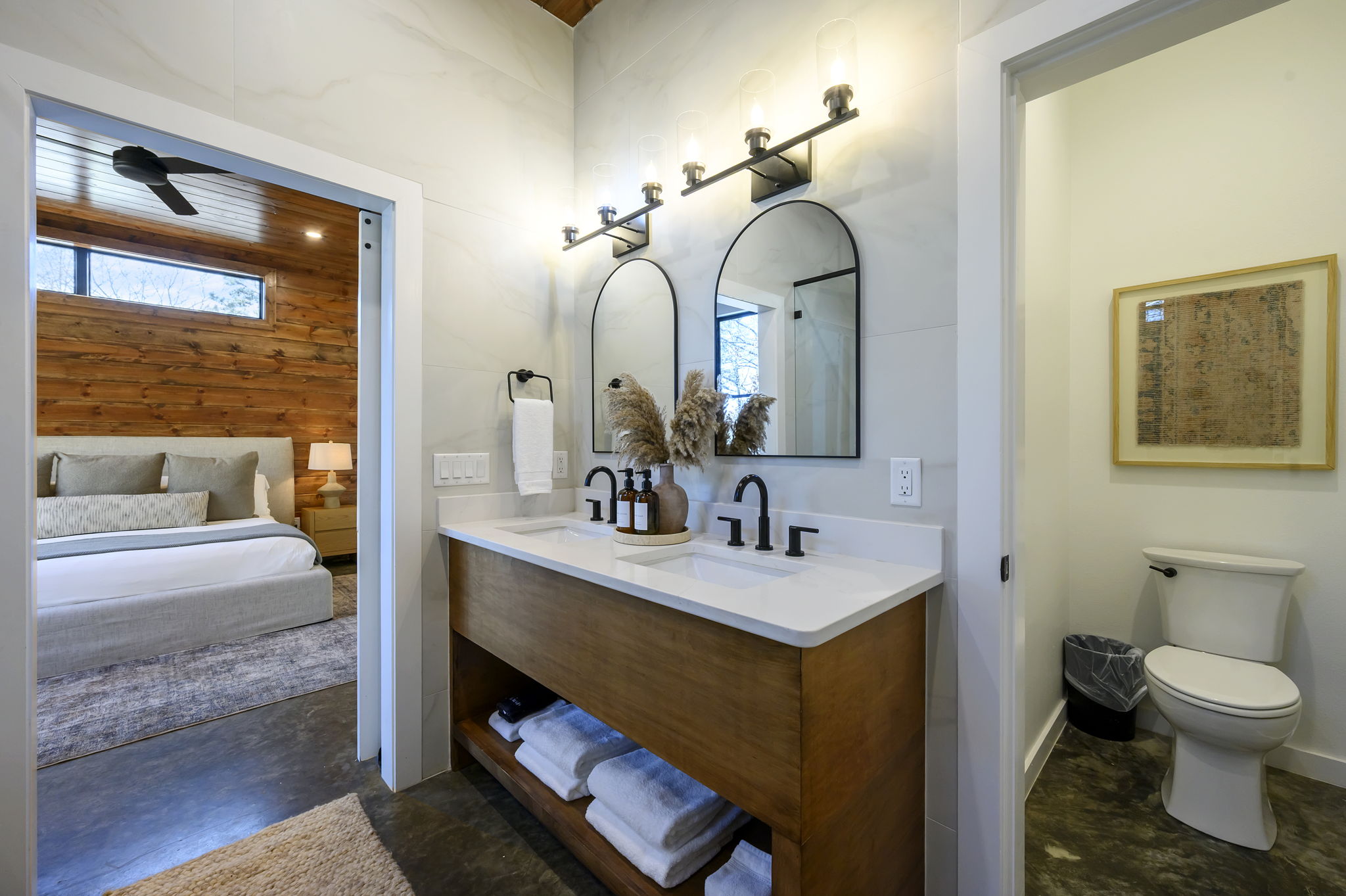 Ensuite Bathroom 3 - Attached to King Suite 3. Featuring enormous rain shower with quad showerheads, and spa-quality marble finishes. Includes premium toiletries (body wash, shampoo, conditioner, hand soap) and hotel quality towels. 