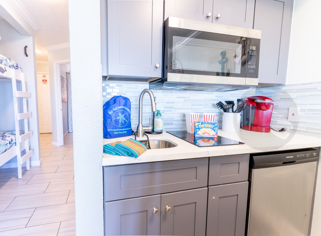 cooktop, microwave, dishwasher, refrigerator and countertop oven