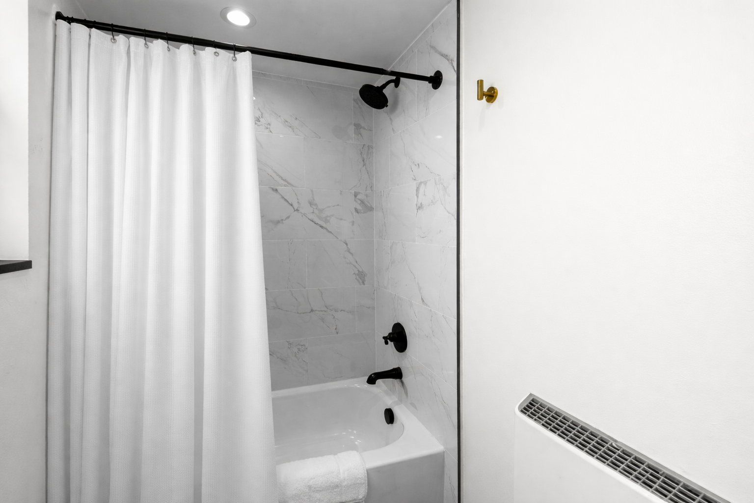 Clean, spa-inspired shower with modern fixtures, soft lighting, and a fresh, minimalist design—perfect for unwinding after a long day.