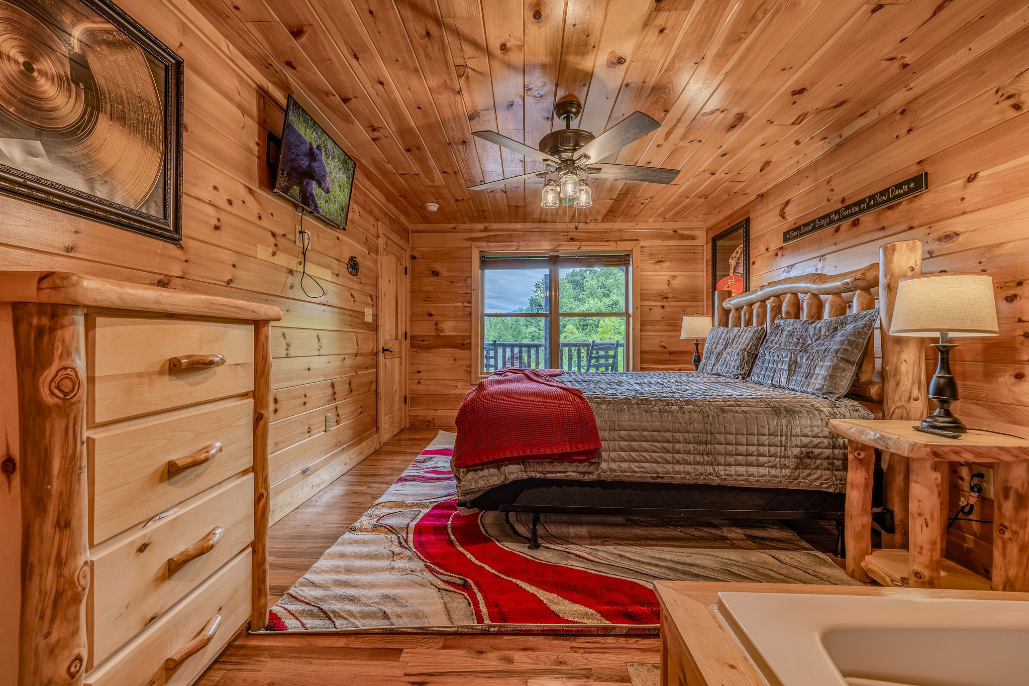 The Rhythm Suite is a lower-level king retreat with private en-suite bathroom access, Smart TV, and a moodier after-hours feel.