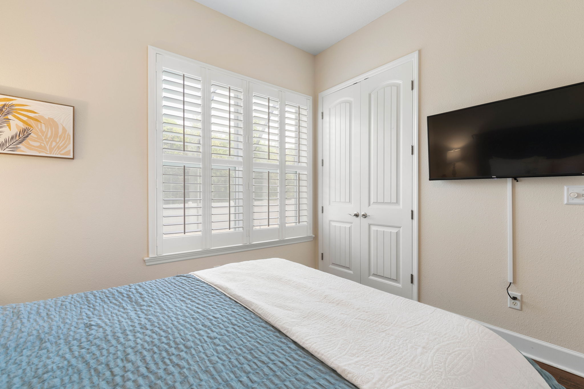 Settle in, turn on your favorite show, and let this quiet coastal bedroom become your personal reset—soft light through the shutters, a cozy bed waiting, and the kind of peaceful rest that makes every beach day even better.