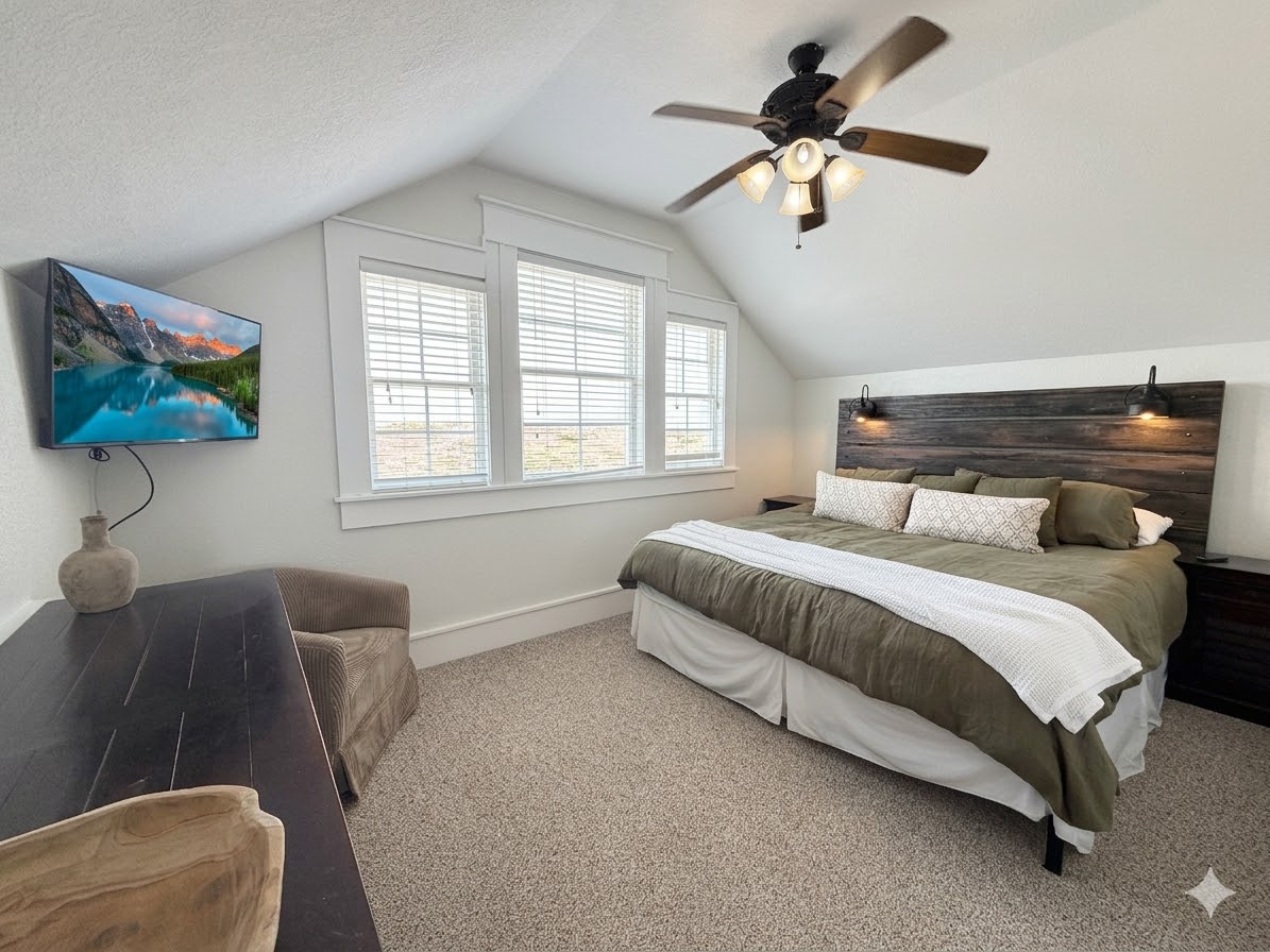 Bedroom 16 — Elegant King Suite with Floral Accents & Comfortable Bedding | Sleeps 40 Guests at The Mark Twain, Outer Banks
