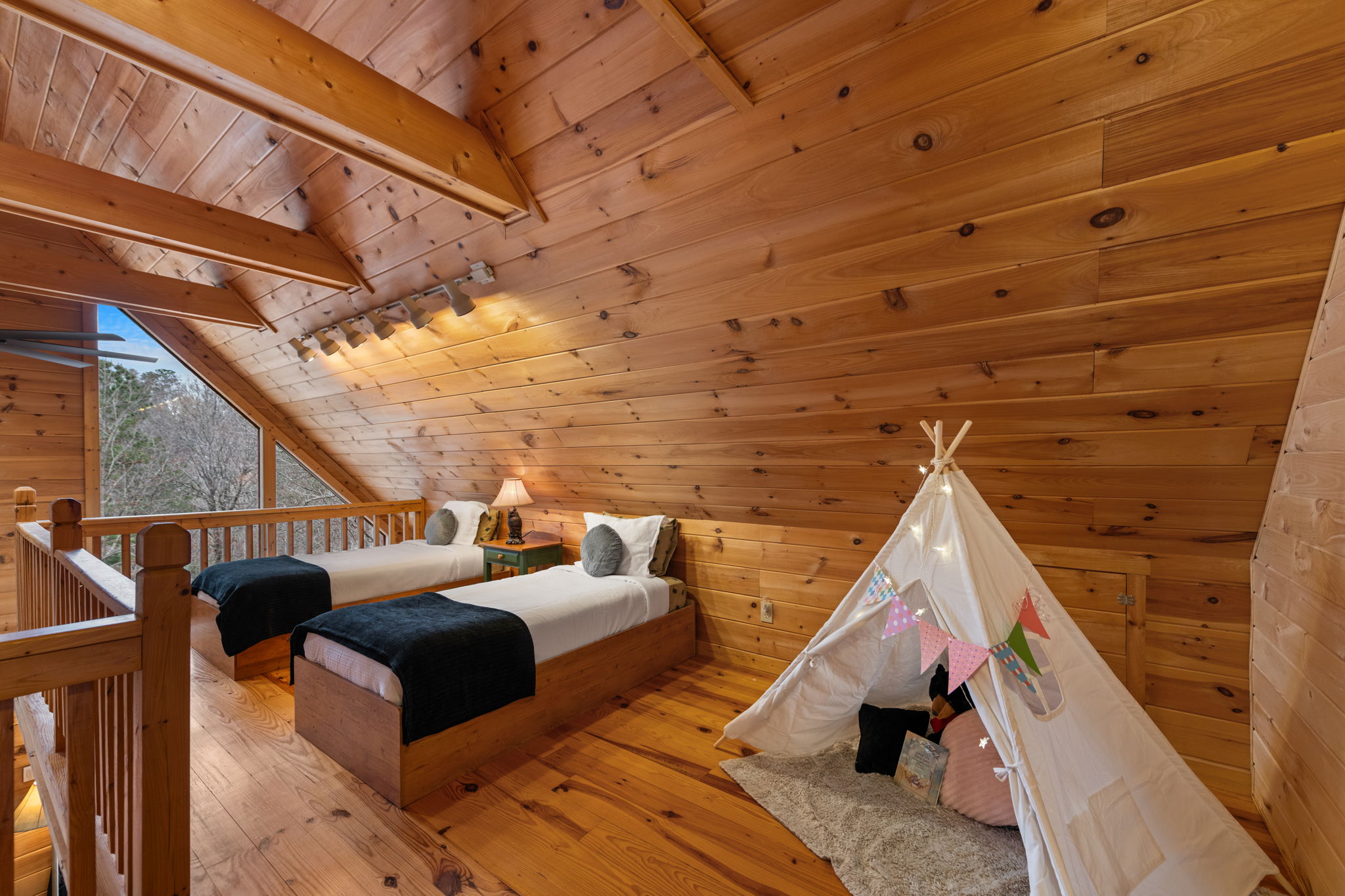 A cozy loft area located just before Bedroom 2 includes two twin-size beds, perfect for additional sleeping space.