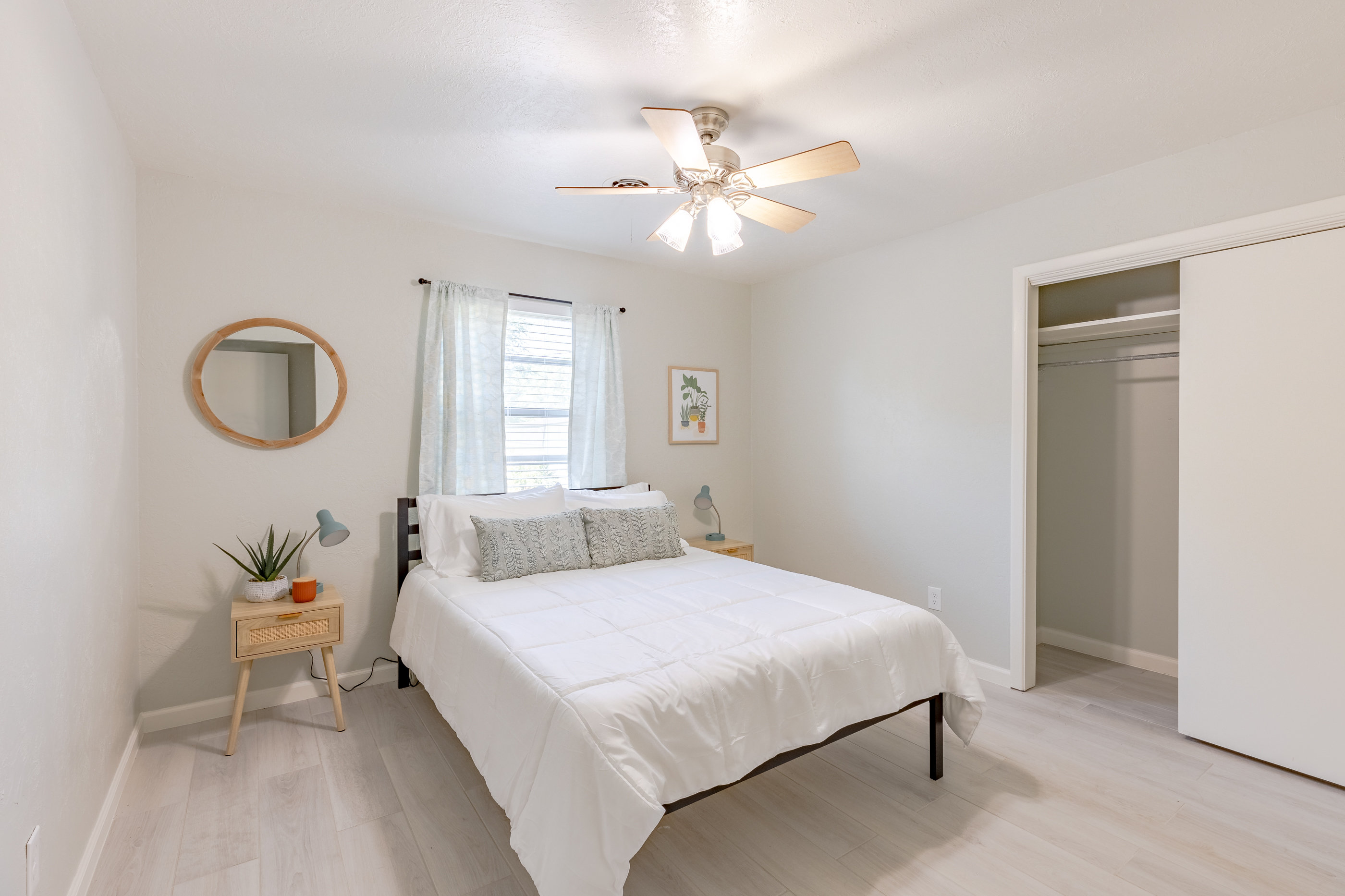 Bright and comfortable guest room with a cozy queen bed.