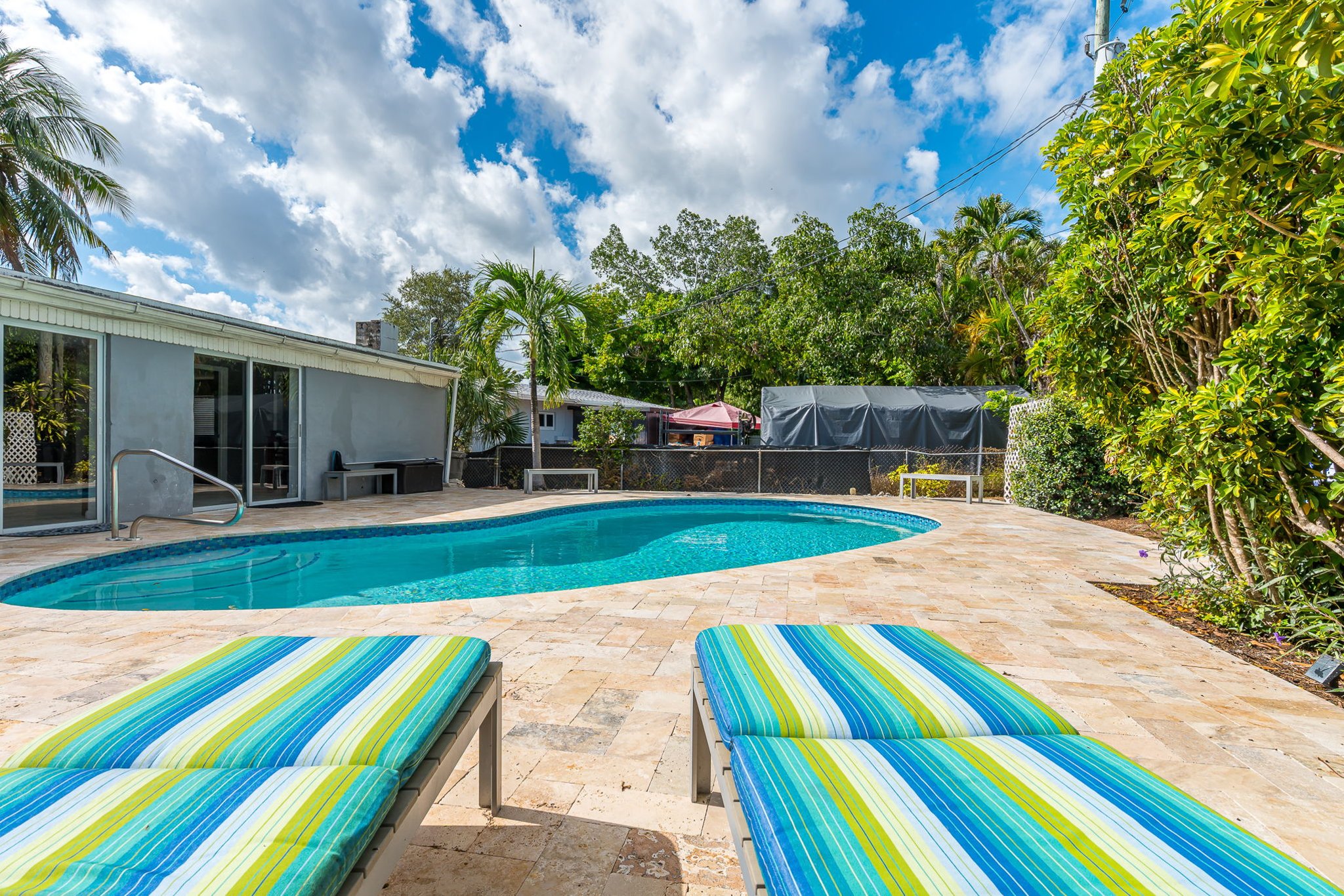 The outside is a highlight, with the heated pool, outdoor sun- loungers, BBQ and covered dining area.