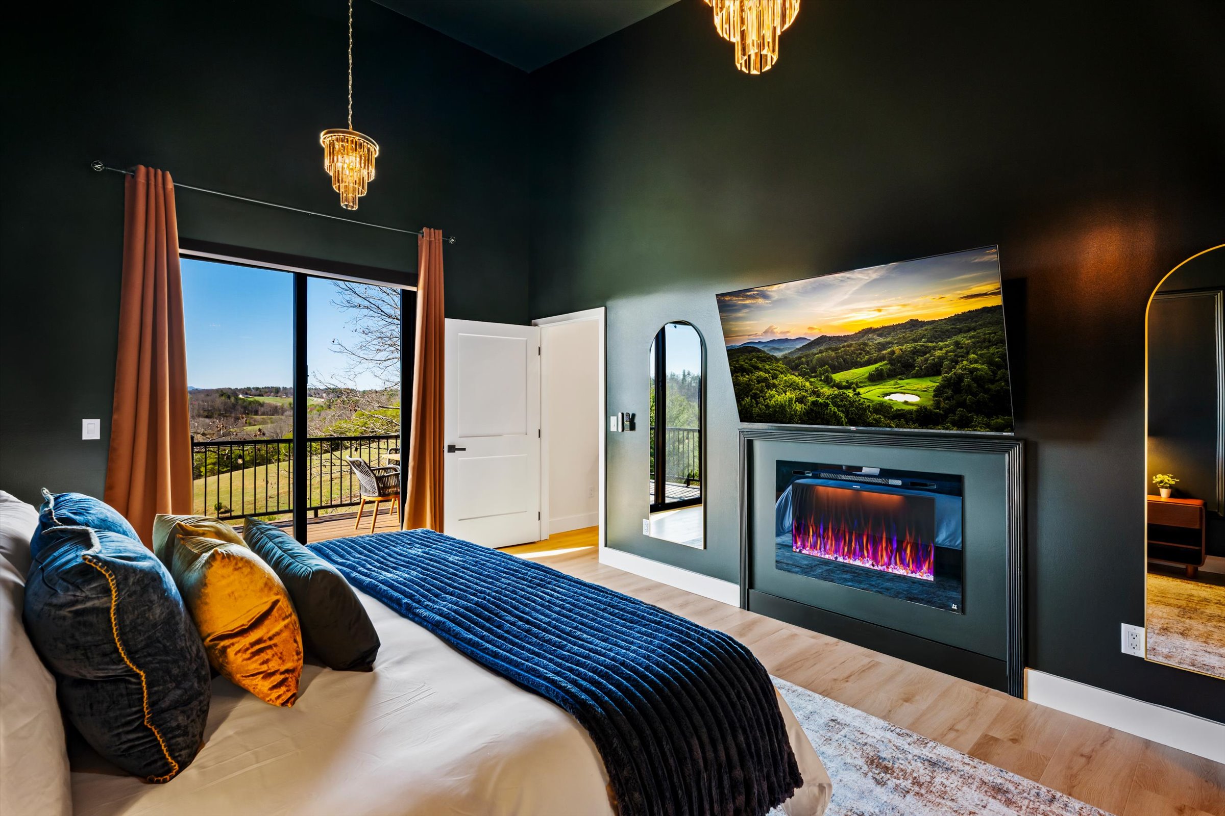 {Master Suite} Wake slowly to mountain views, step onto the balcony with your coffee, and end the night by the fire after a full day well spent.