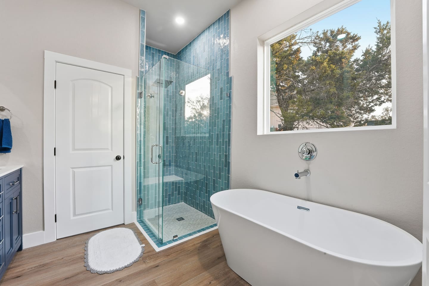 Large ensuite bathroom with dual vanity and generous walk-in shower.