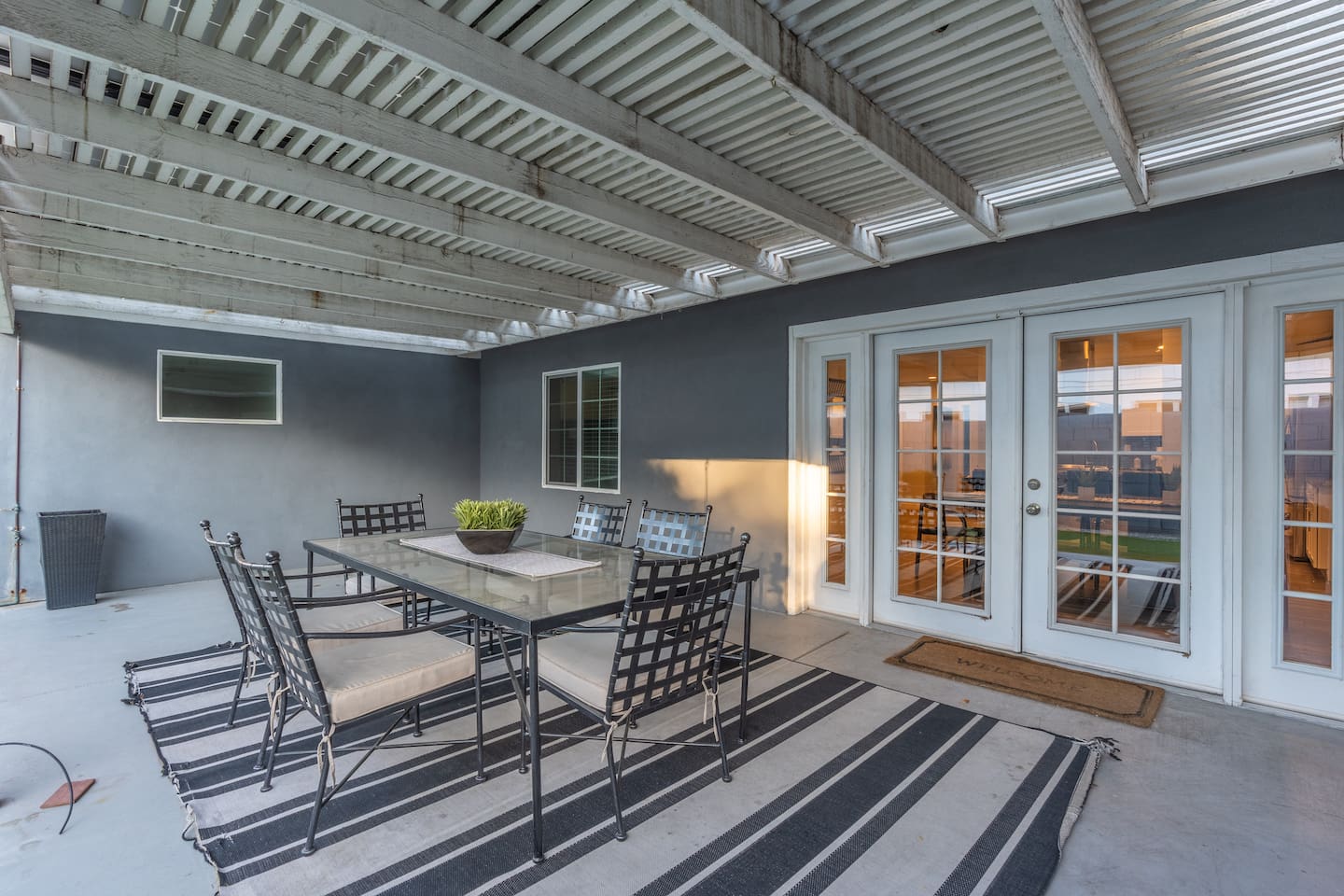 Inviting backyard with a dining area, perfect for enjoying meals outdoors in a relaxed and serene environment.