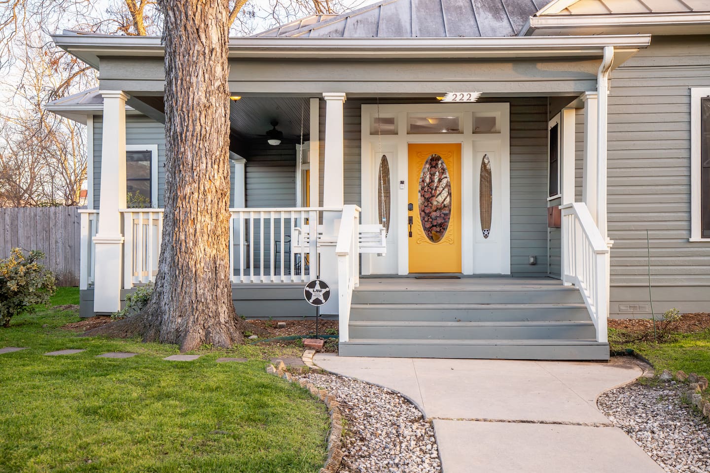Step into a space where classic comfort meets modern convenience, all starting from an inviting porch that whispers 'stay awhile'. 