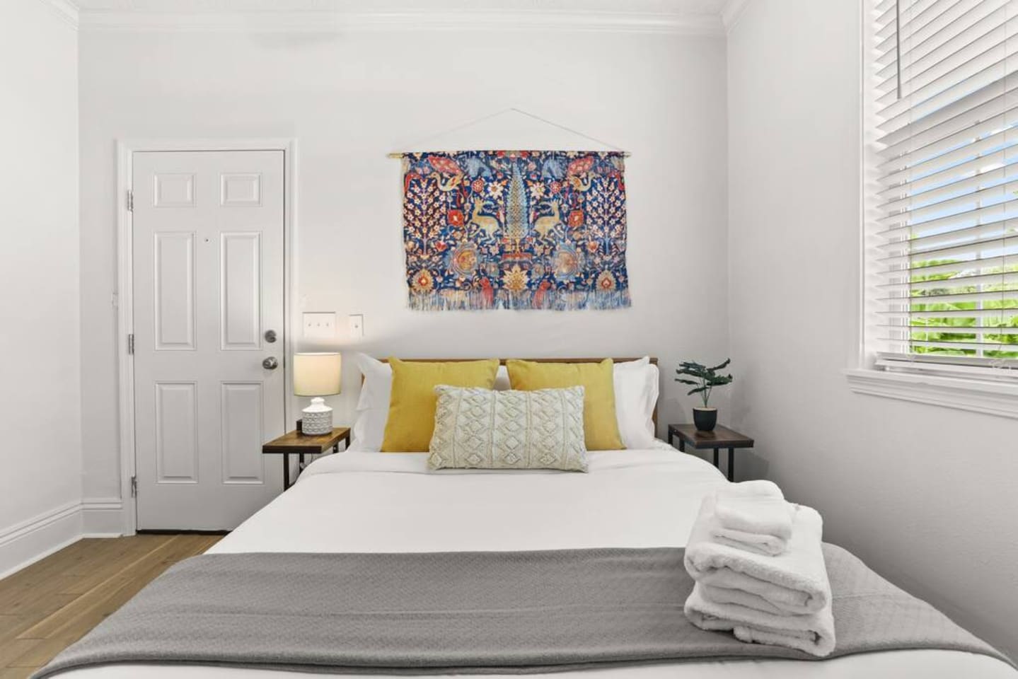 The master bedroom has a Roku TV, comfy queen bed, full en suite bathroom, direct and back porch/yard access.