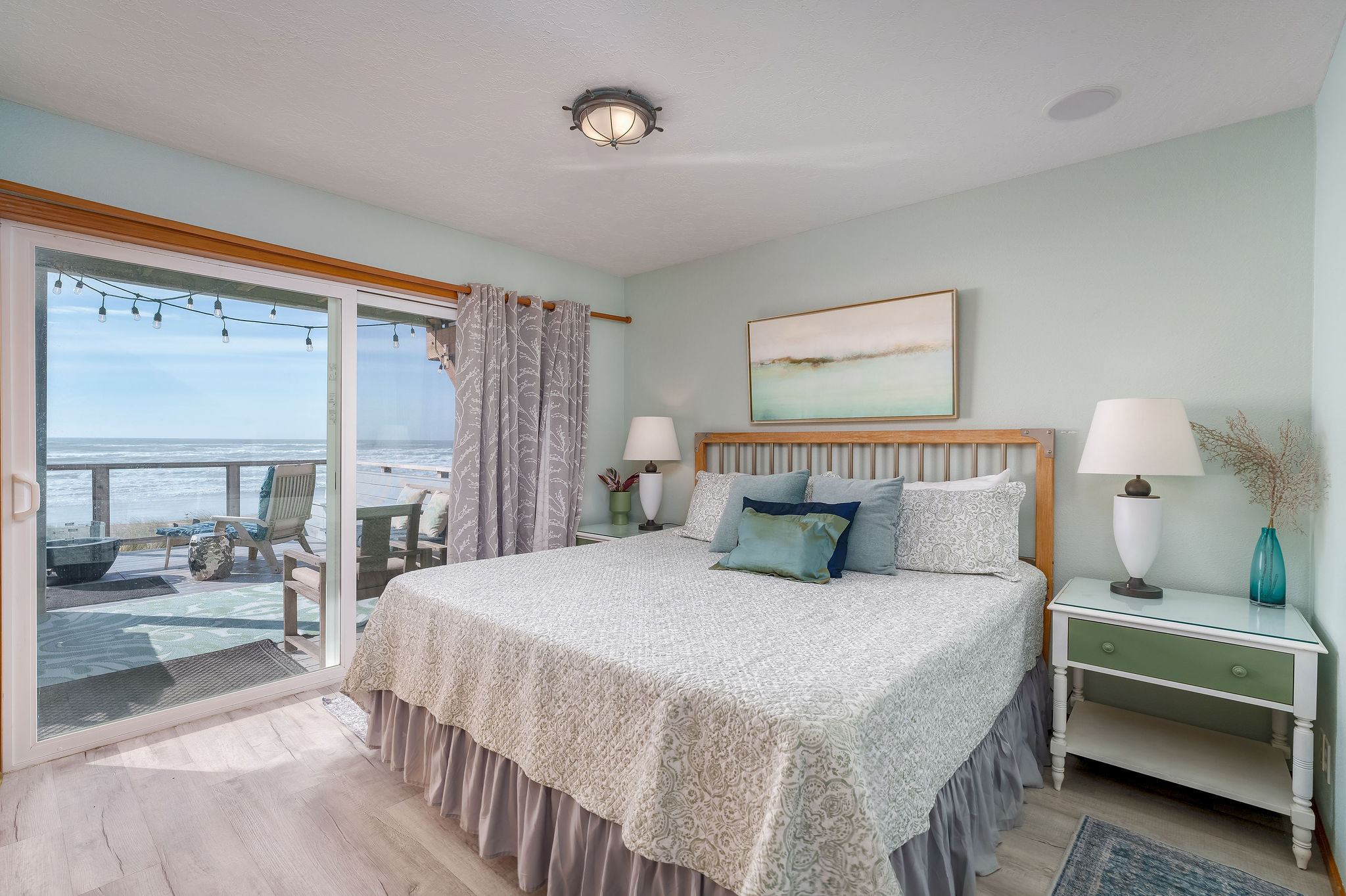 Experience the tranquility of seaside living with a king size bed for your comfort. Not pictured is a twin bed in the same room.