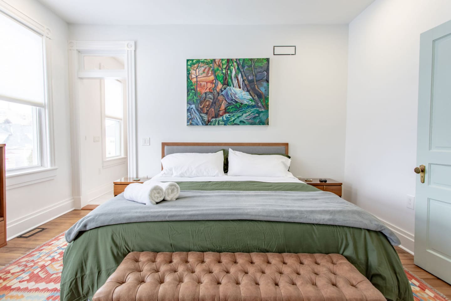 A spacious master bedroom with a minimalist accent, featuring clean lines, simple décor, and a calming color palette, creating a serene and uncluttered retreat. There is a private en-suite master bathroom included. 