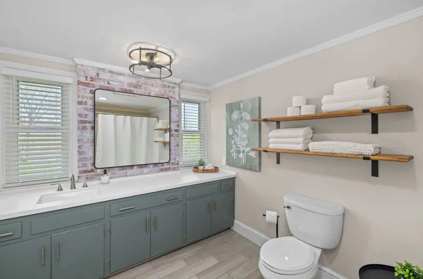 Full bathroom in the Oak Canopy Suite includes sink, toilet, & tub/shower.