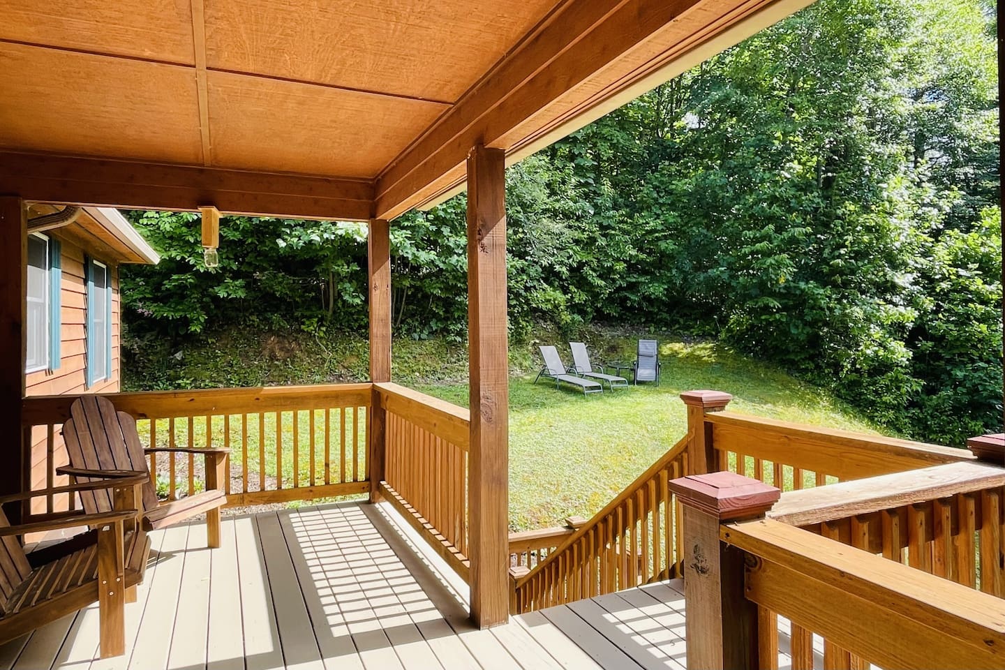 Side porch looking at lounge seating of the "Stargazer's Landing."