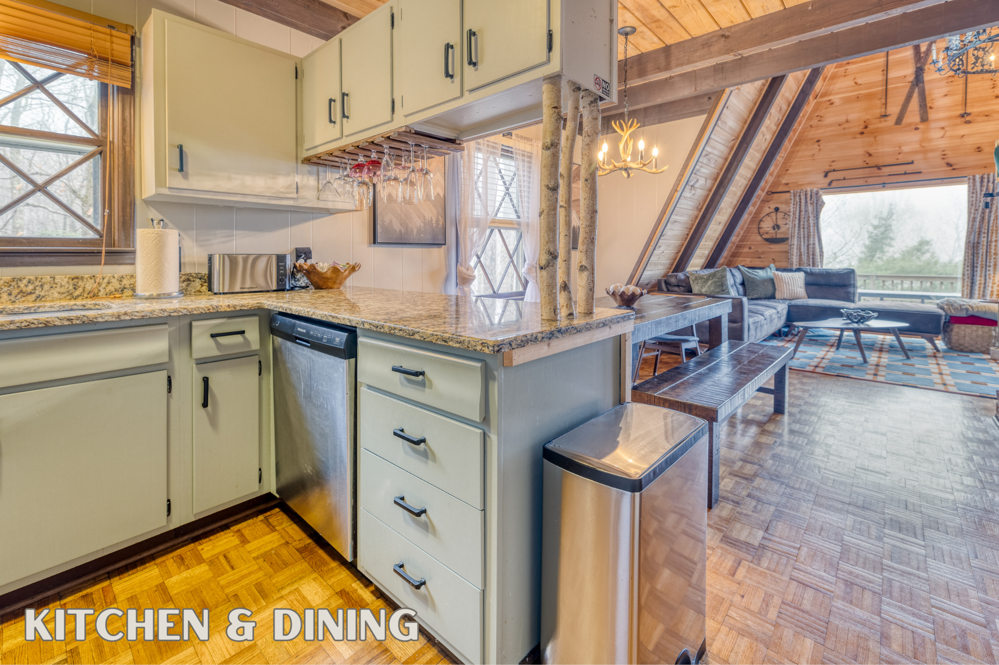 The fully equipped kitchen with granite countertops and stainless steel appliances adjoins a welcoming dining area, ideal for family meals and gatherings.