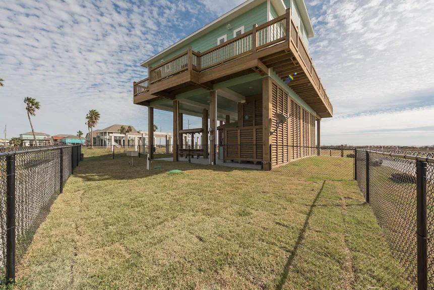 Breezy Point Fenced Backyard: The fenced yard provides extra peace of mind and space to enjoy outdoor activities with family and friends.