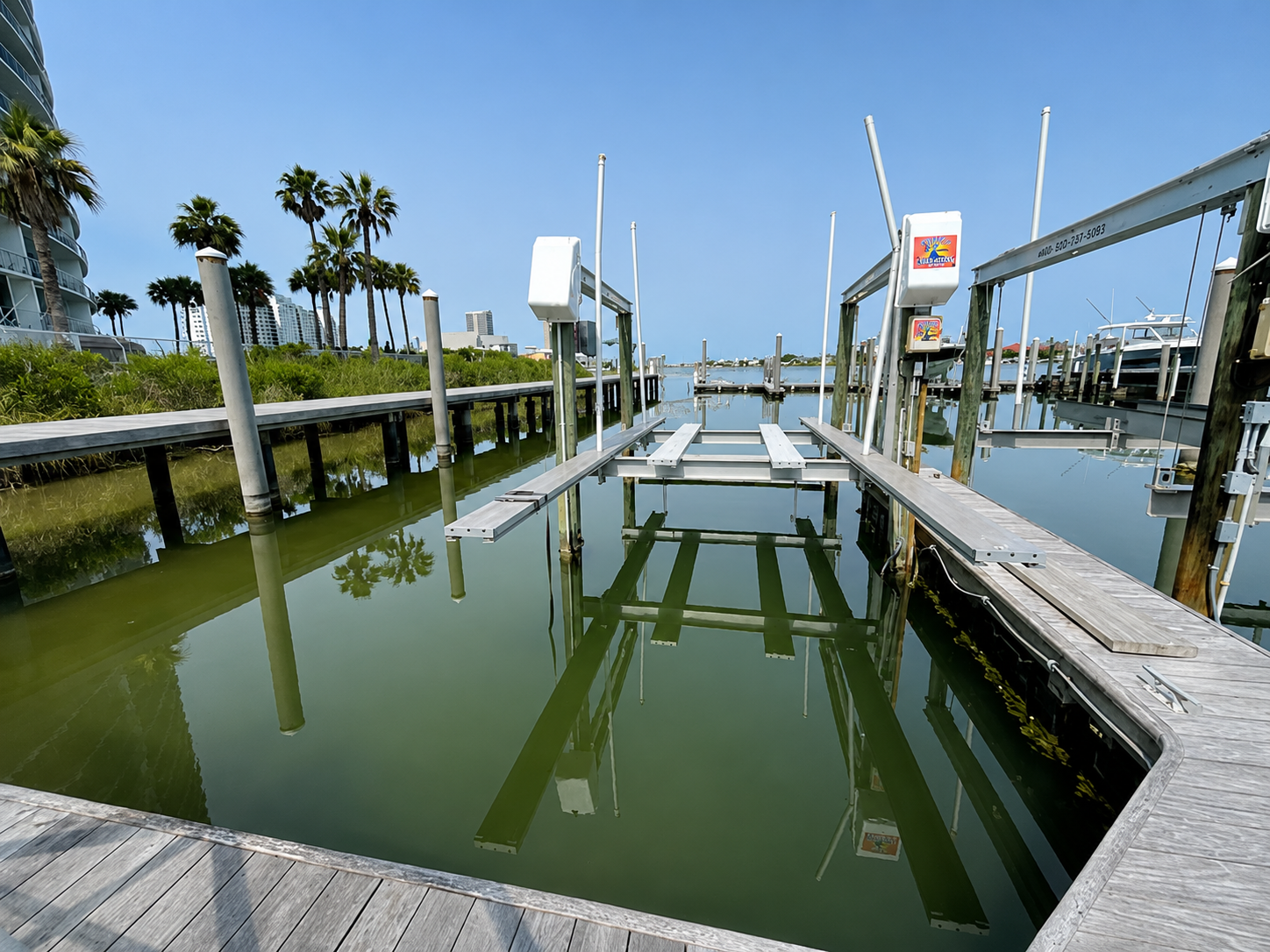 B1 Boat slip comes with rental.  Please see lift picture- Cross beam and slats therefore v-hull boat would not work on lift.  Just Pontoon or Tritoon.  